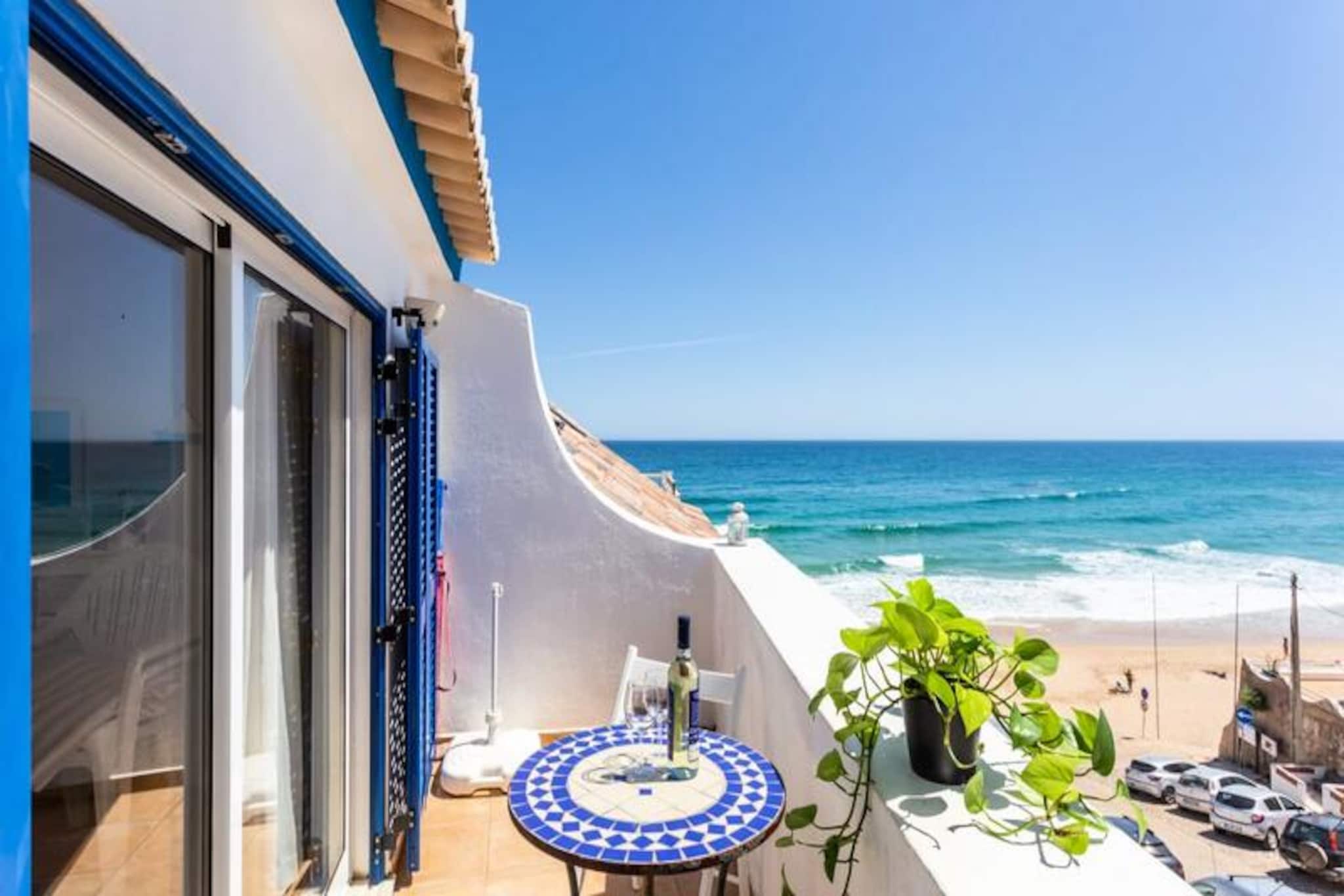 Imagine waking up to the soothing sound of waves and stepping outside to find yourself just 50 meters from the golden sands of Burgau Beach. This charming renovated fisherman’s cottage, perched on the slipway, offers an unbeatable location with panoramic ocean views that will take your breath away. Nestled in the heart of the picturesque fishing village of Burgau, the property is surrounded by cobbled streets, quaint restaurants, and the lively atmosphere of traditional Portuguese coastal life. Whether you’re sipping coffee on the rooftop terrace or strolling to the beach bar, every moment here feels like a postcard come to life. 

Inside, the cottage exudes character and charm. Spread over two floors, it features a cozy bedroom, a fully equipped modern kitchen, and a comfortable living area with Wi-Fi and TV. The narrow staircases and compact rooms add to its dollhouse-like appeal, making it a unique and intimate retreat. The highlight is undoubtedly the rooftop terrace, where you can enjoy uninterrupted views of the Atlantic Ocean, perfect for morning sunrises or evening stargazing. Linens and towels are provided, ensuring a hassle-free stay. 

Burgau is a hidden gem in the western Algarve, offering a peaceful escape while still being close to some of the region’s best attractions. Within a 15-minute drive, you’ll find world-class surfing beaches, scenic golf courses, and hiking trails. The village itself boasts excellent seafood restaurants and bars overlooking the sea, making it an ideal base for both relaxation and exploration. Whether you’re planning to surf, hike, or simply unwind by the beach, this location has it all. 

With free parking nearby and a dedicated rental management team to assist you, your stay in Burgau promises to be as seamless as it is memorable. Come and experience the authentic charm of this coastal haven, where every day feels like a dream.