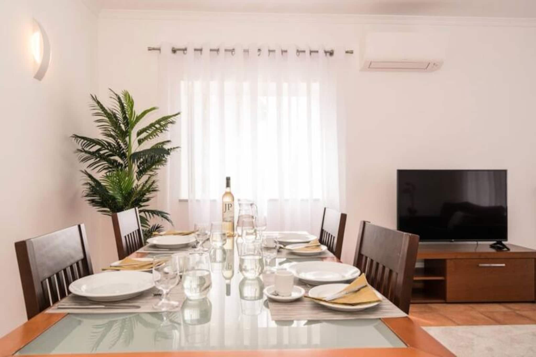 Imagine waking up to the soft sounds of the ocean breeze and stepping out onto your private terrace to soak in the golden Portuguese sun. This luxurious two-bedroom apartment in the prestigious Porto de Mós area of Lagos offers the perfect blend of comfort, style, and convenience for your dream holiday. Nestled within a serene complex, this property provides a tranquil escape while being just moments away from the vibrant charm of Lagos.
Step inside to discover a bright and airy living space, tastefully furnished to the highest standards. The master bedroom features a plush king-size bed and an en-suite bathroom with both a bathtub and a walk-in shower, ensuring ultimate relaxation. The second bedroom, with two comfortable single beds, is perfect for families or friends traveling together. A second modern bathroom with a walk-in shower adds to the convenience. The fully equipped kitchen invites you to prepare delicious meals, while the spacious living and dining area is ideal for unwinding after a day of exploration.
The complex boasts a stunning palm-fringed swimming pool, a well-equipped gym, and even a small children’s playground, catering to all ages. Sun loungers around the pool offer the perfect spot to relax and enjoy the Algarve’s warm climate. For those who prefer the beach, the golden sands of Porto de Mós are less than a 10-minute walk away, where you’ll find beachfront restaurants and breathtaking views.
The lively historic town of Lagos, with its cobbled streets, picturesque marina, and vibrant nightlife, is just an 8-minute drive away. Whether you’re exploring the dramatic cliffs of Ponta da Piedade, enjoying water sports, or indulging in local cuisine, this apartment serves as the perfect base for your Algarve adventure. With easy access to public transport and nearby golf courses, your stay promises to be as relaxing or as active as you desire.