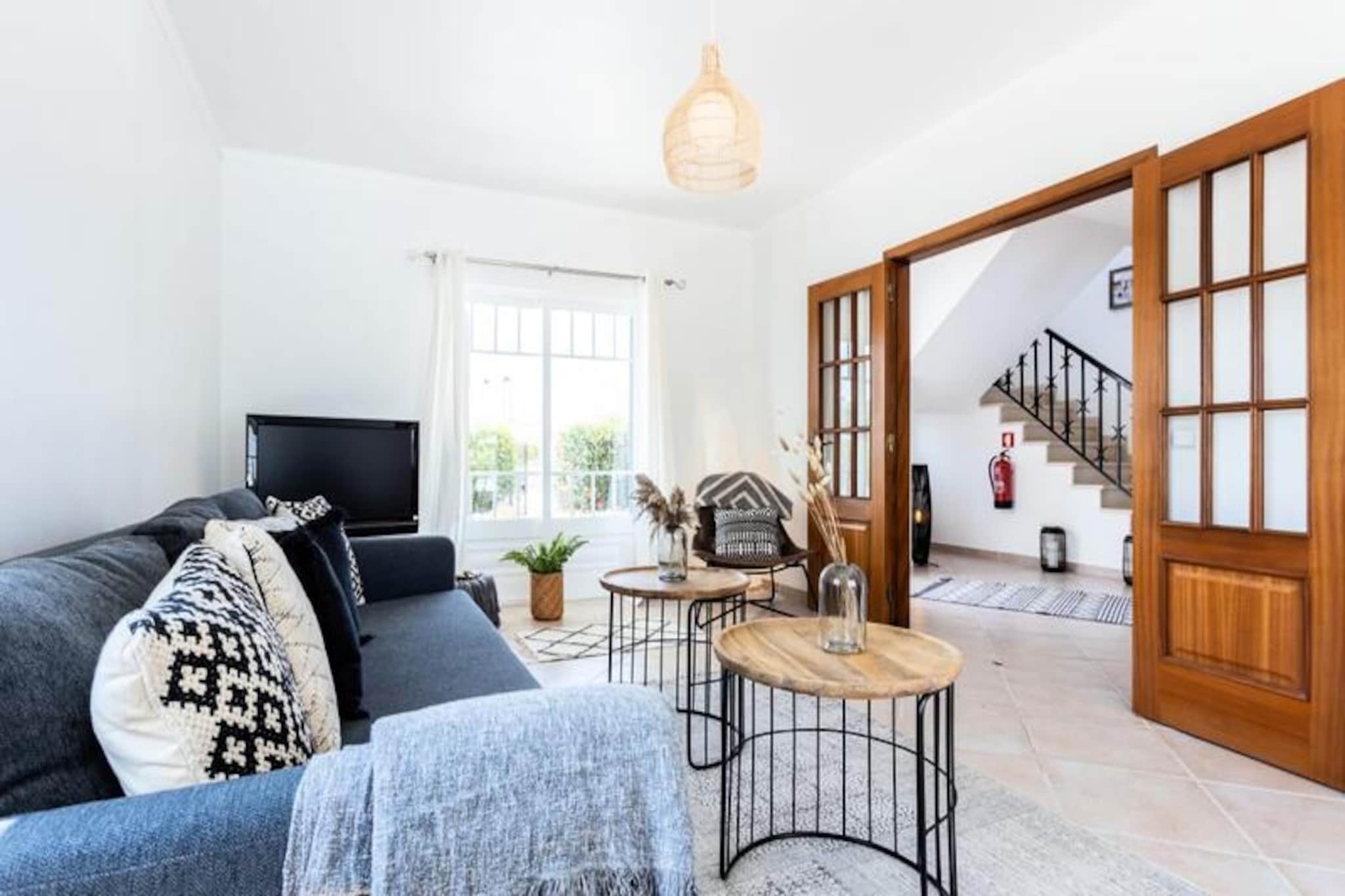 Imagine waking up to the soothing sound of ocean waves and stepping onto your private balcony to take in panoramic views of the Atlantic. This elegant villa in the heart of Vale da Telha offers a serene retreat surrounded by the natural beauty of the Costa Vicentina Nature Reserve. With its seamless blend of modern comfort and timeless charm, this property promises an unforgettable holiday experience for families, nature enthusiasts, and surfers alike. 
 
 The villa boasts three spacious bedrooms, including a master suite with dual balconies offering breathtaking views of the ocean and the lush garden. The open-plan kitchen and dining area is fully equipped and designed for social gatherings, with direct access to a sunlit patio and a private swimming pool. For added comfort, the villa features air conditioning, double-glazed windows, and exterior shutters in all rooms. Relax in the cozy living room, where large windows and triple doors flood the space with natural light, creating a warm and inviting atmosphere. 
 
 Step outside to discover your private oasis: a sheltered pool area with an optional safety barrier for families, a jacuzzi for ultimate relaxation, and a barbecue dining area overlooking the beautifully maintained garden. Whether you're enjoying a quiet evening under the stars or a lively family meal, this outdoor space is perfect for creating cherished memories. 
 
 Located just minutes from the stunning Monte Clérigo and Arrifana beaches, this villa is ideally positioned for exploring the Algarve's pristine coastline. The nearby village of Vale da Telha offers charming restaurants, bars, and a small supermarket, while the historic town of Aljezur is a short drive away. For adventure seekers, the surrounding nature reserve provides endless opportunities for hiking, surfing, and wildlife spotting. With Faro Airport just 80 minutes away, this villa is your gateway to the best of Portugal's unspoiled beauty.