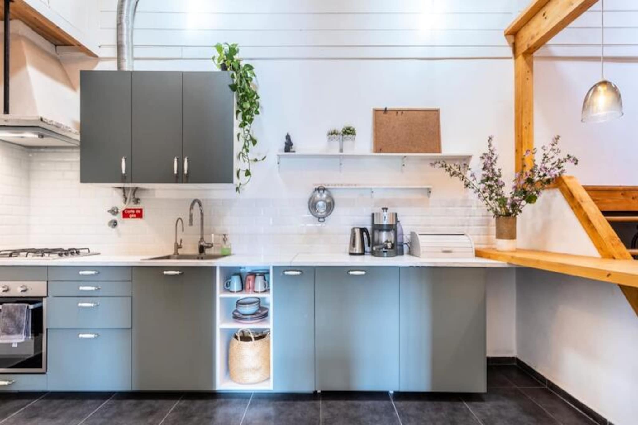 Imagine waking up to the serene beauty of the Monchique mountains and the colorful farmland surrounding Aljezur. Casa Aljezur offers a tranquil escape in a charming Portuguese neighborhood, where the rustic charm of the village meets the comforts of a well-equipped home. This is the perfect retreat for travelers seeking a blend of authentic local culture and breathtaking natural scenery. 
 
 The house features two cozy bedrooms, a spacious bathroom with a walk-in shower, and a mezzanine dining area that invites you to enjoy meals with a view. The kitchen is fully equipped, including a reverse osmosis water filter, ensuring convenience and sustainability. Step out onto the terrace and take in the magnificent views of Aljezur’s historic town and lush surroundings. With amenities like a washing machine, television, and thoughtful touches throughout, Casa Aljezur ensures a comfortable stay. 
 
 Located on a hill, the property offers easy access to the heart of Aljezur, just a 5-minute walk away. Stroll through the narrow streets to discover the municipal market, where you can purchase fresh fish and produce, or explore landmarks like the old Moorish castle and the village church. For beach lovers, Amoreira Beach is a short drive away, offering a unique mix of sandy shores, dunes, and natural pools teeming with marine life. The area is also a hiker’s paradise, with the Vicentina Route and Fisherman’s Trail nearby. 
 
 Whether you’re here to surf, hike, or simply relax, Casa Aljezur provides the perfect base for your adventures. With its warm atmosphere, friendly neighbors, and proximity to both nature and culture, this hidden gem is an invitation to experience the best of Portugal.