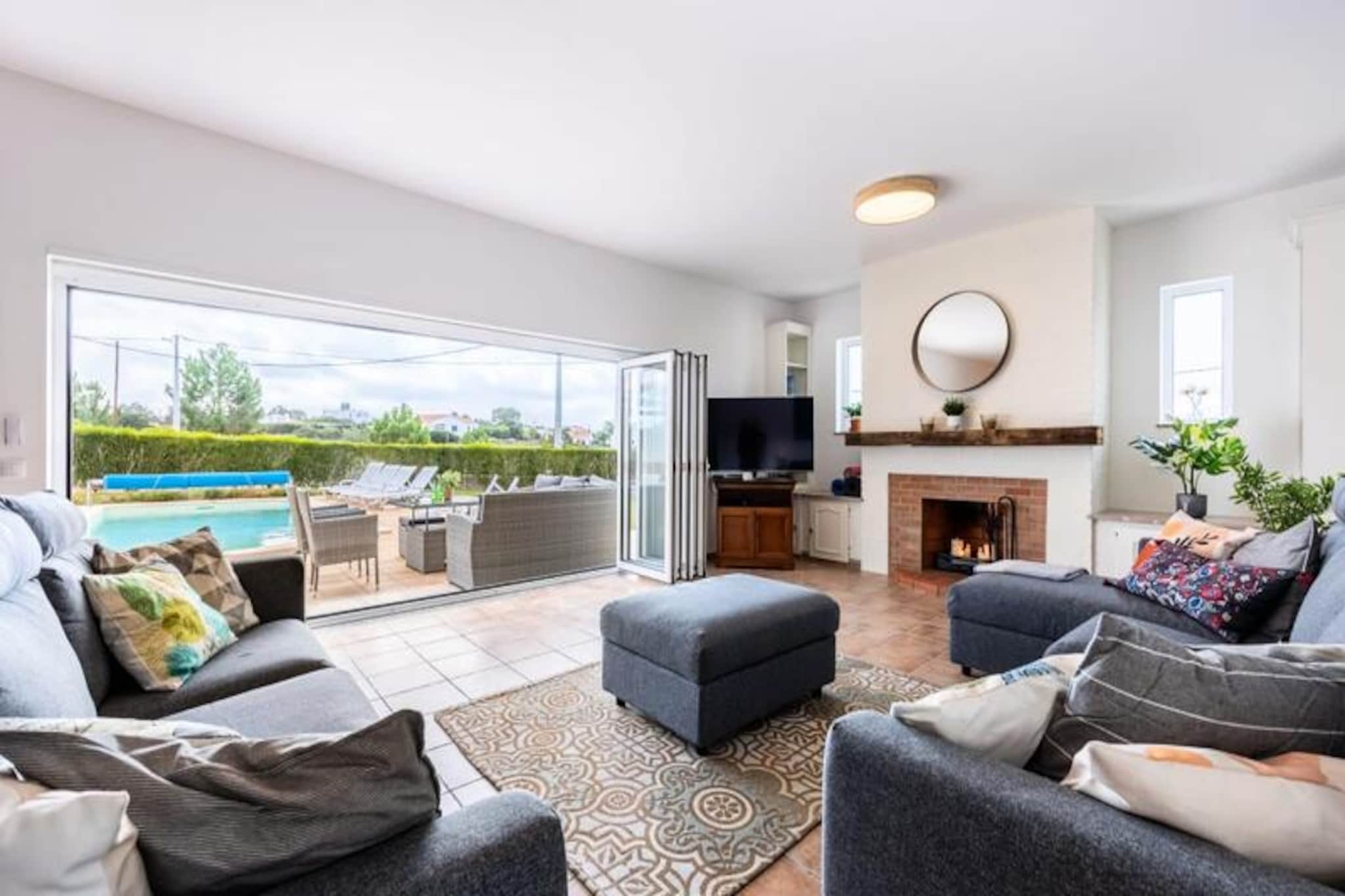 In the heart of the Costa Vicentina Nature Reserve, Casa dos Sonhadores invites you to experience the Algarve's serene beauty. This Mediterranean villa is surrounded by lush landscapes and is just a five-minute drive from pristine beaches, making it the perfect retreat for families or groups seeking relaxation and adventure. Imagine waking up to the gentle sounds of nature, enjoying your morning coffee on the sunlit terrace, and planning a day of exploration or leisure by the pool.
The villa’s interiors are designed with comfort and style in mind. The grand entrance hall leads to a spacious living room with glass doors that open onto the pool terrace. A raised dining area overlooks this space, creating a seamless flow between indoor and outdoor living. The fully equipped kitchen is perfect for preparing meals, while the five bedrooms, each with built-in wardrobes, offer restful sanctuaries for up to 12 guests. Modern bathrooms with high-end fixtures add to the luxurious feel, and amenities like air conditioning, high-speed Wi-Fi, and central heating ensure a comfortable stay year-round.
Step outside to discover a private pool surrounded by terraces and a lush garden, maintained year-round by an irrigation system. The outdoor kitchen, complete with a barbecue, pizza oven, and cooktop, is ideal for al fresco dining. Whether you’re lounging by the pool, enjoying a family barbecue, or taking in the partial sea views from the south-facing terrace, every moment here feels special.
Beyond the villa, the Costa Vicentina Nature Reserve offers countless hiking trails through pine forests and along dramatic cliffs. Nearby, the historic town of Aljezur and the vibrant city of Lagos provide cultural and culinary delights, while world-renowned beaches like Arrifana and Monte Clérigo are a haven for surfers and sunbathers alike. With Faro Airport just 75 minutes away, Casa dos Sonhadores is your gateway to an unforgettable Algarve escape.