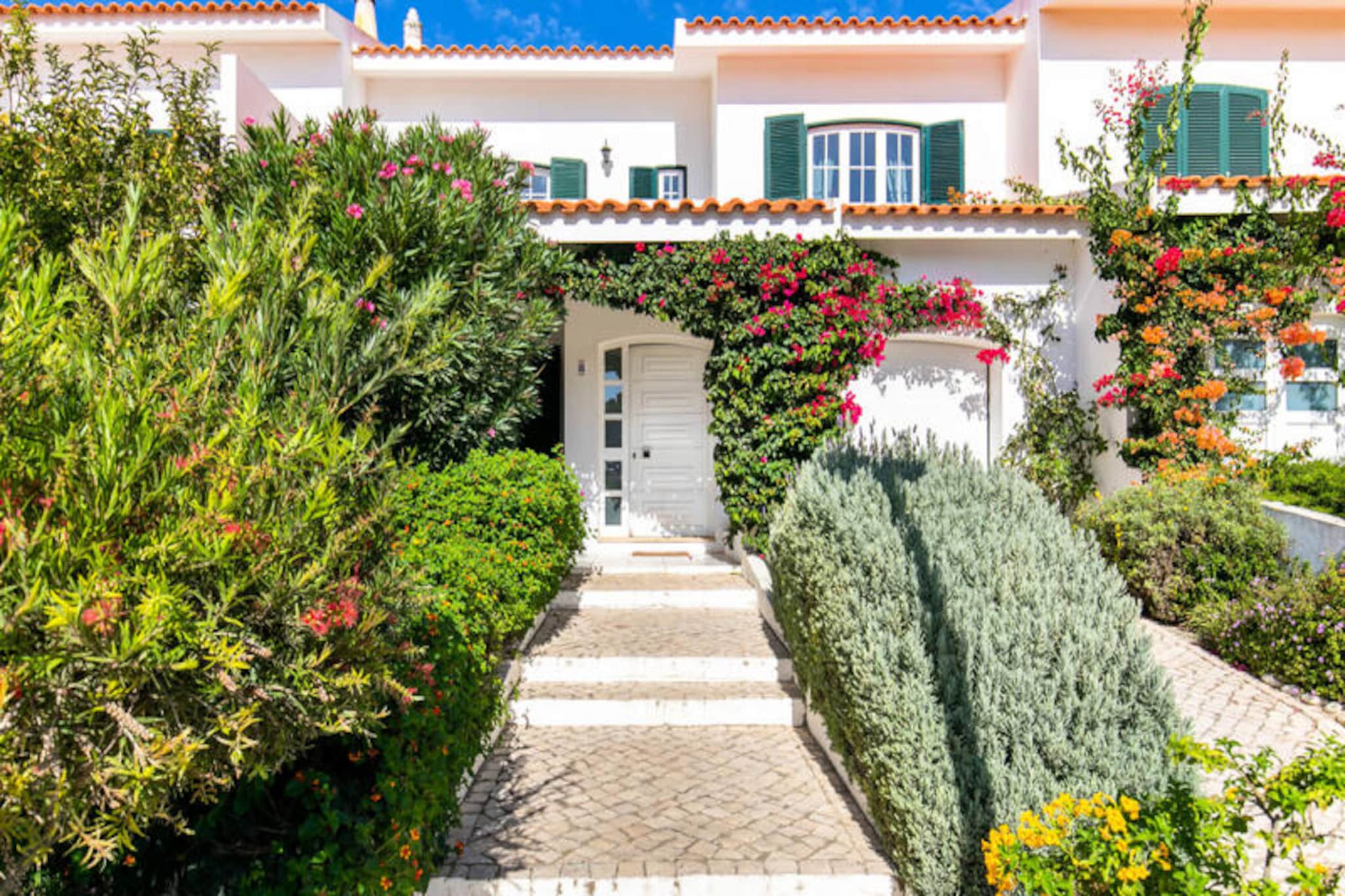 In the serene coastal town of Sagres, this charming 3-bedroom townhouse offers a perfect blend of comfort and convenience, making it an ideal retreat for families or small groups. Just a 5-minute stroll from Praia da Mareta beach and the lively town center, the property is nestled in a quiet residential area, ensuring both tranquility and easy access to local attractions. Whether you're seeking sun-soaked days on the sand or exploring the rugged beauty of the Algarve, this home provides an excellent base for your adventures. 

Inside, the townhouse is thoughtfully designed to cater to your every need. The first floor features three inviting bedrooms: a master bedroom with a double bed, en-suite bathroom, and private balcony; a cozy double bedroom with patio access; and a family room accommodating up to three guests with a small double bed and a single bed. Two additional bathrooms, a bright and spacious living area, and an open-plan kitchen on the ground floor ensure a comfortable stay for up to seven guests. Modern amenities such as Wi-Fi, a television, and a washing machine are provided, along with linens and towels for your convenience.

Step outside to discover the property’s delightful outdoor spaces. A lush garden with a small dining table greets you at the front, while a large patio at the rear boasts a barbecue and ample seating for al fresco meals. The peaceful neighborhood is perfect for families with children, though please note that the stairs are not equipped with safety gates. Free street parking is available nearby, and while buses run regularly to Sagres, renting a car is recommended for exploring the region.

From the dramatic cliffs of Cabo de São Vicente to the golden sands of Beliche Beach, Sagres is a destination brimming with natural beauty and cultural charm. With its prime location, welcoming ambiance, and thoughtful amenities, this townhouse invites you to create unforgettable memories in the heart of the Algarve.