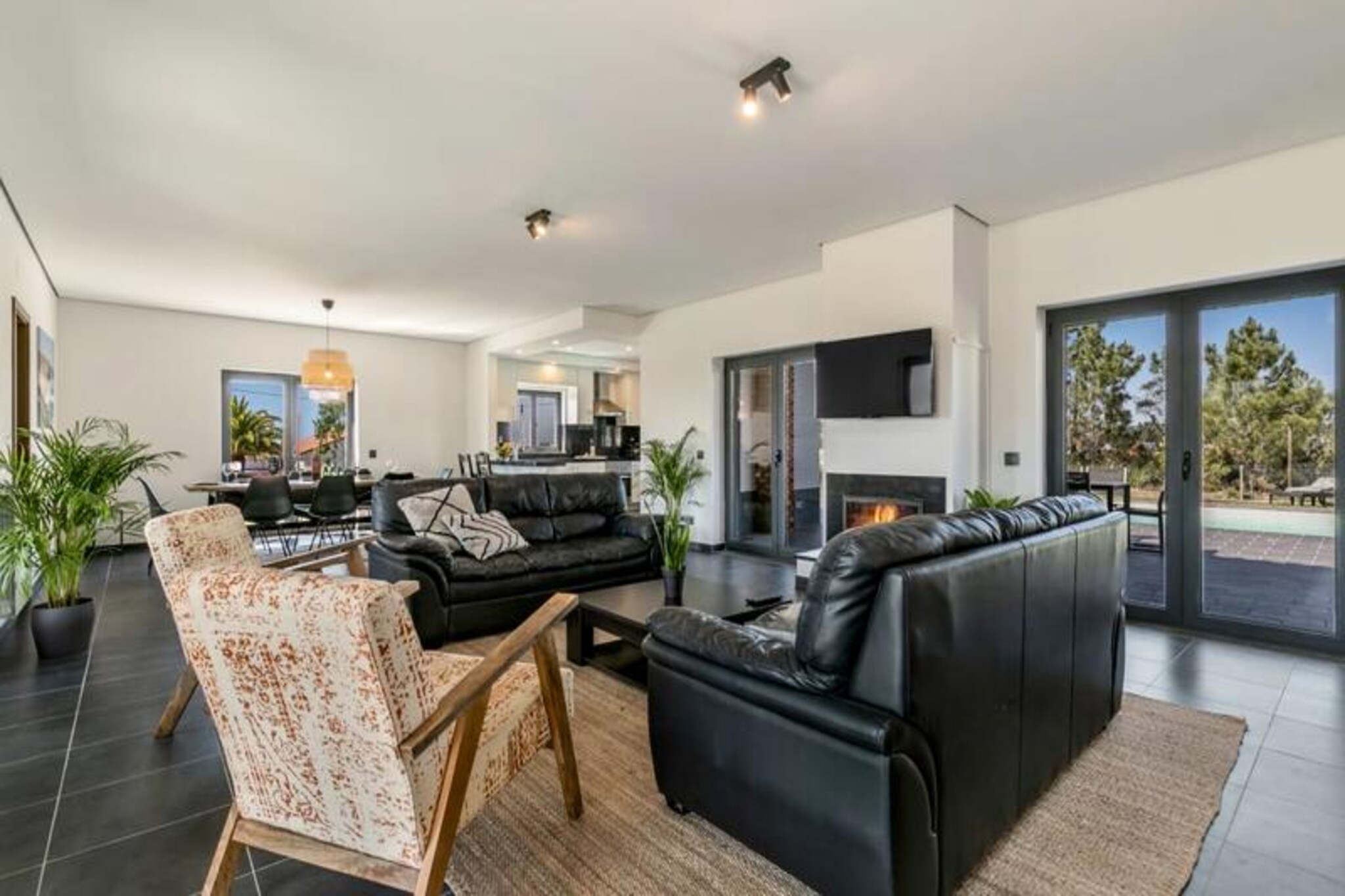 In the serene embrace of the Costa Vicentina Natural Park, Casa Amizade offers a luxurious retreat where modern comfort meets the raw beauty of Portugal's western Algarve. This stunning five-bedroom villa in Vale da Telha is perfect for families or groups of up to ten, promising a memorable holiday filled with relaxation and adventure. From the moment you arrive, the tranquil surroundings and breathtaking ocean views will captivate your senses. 

Step inside to discover a spacious and tastefully decorated interior. Four of the five bedrooms boast en-suite bathrooms, each with French doors opening onto the lush garden or private balconies. The open-plan living and dining area is bathed in natural light, seamlessly connecting to a fully equipped, modern kitchen designed for culinary gatherings. Outside, the private heated pool (available for an extra charge) invites you to unwind under the Algarve sun, while the outdoor kitchen and barbecue set the stage for al fresco dining. The upstairs master bedroom balconies provide a front-row seat to spectacular sunsets over the Atlantic, creating unforgettable moments. 

Located just a five-minute drive from some of the Algarve's most pristine beaches, Casa Amizade is a gateway to the region's natural wonders. Explore the dramatic cliffs, golden sands, and consistent Atlantic waves that make this area a haven for surfers and nature enthusiasts alike. The charming town of Aljezur, with its historic castle, local markets, and delightful restaurants, is also nearby, offering a taste of authentic Portuguese culture. 

Whether you're hiking the scenic trails of the Costa Vicentina, savoring fresh seafood at a local eatery, or simply relaxing by the pool, Casa Amizade provides the perfect setting for an unforgettable getaway. With its blend of luxury, privacy, and proximity to nature, this villa is more than just a holiday home—it's an experience waiting to be cherished.