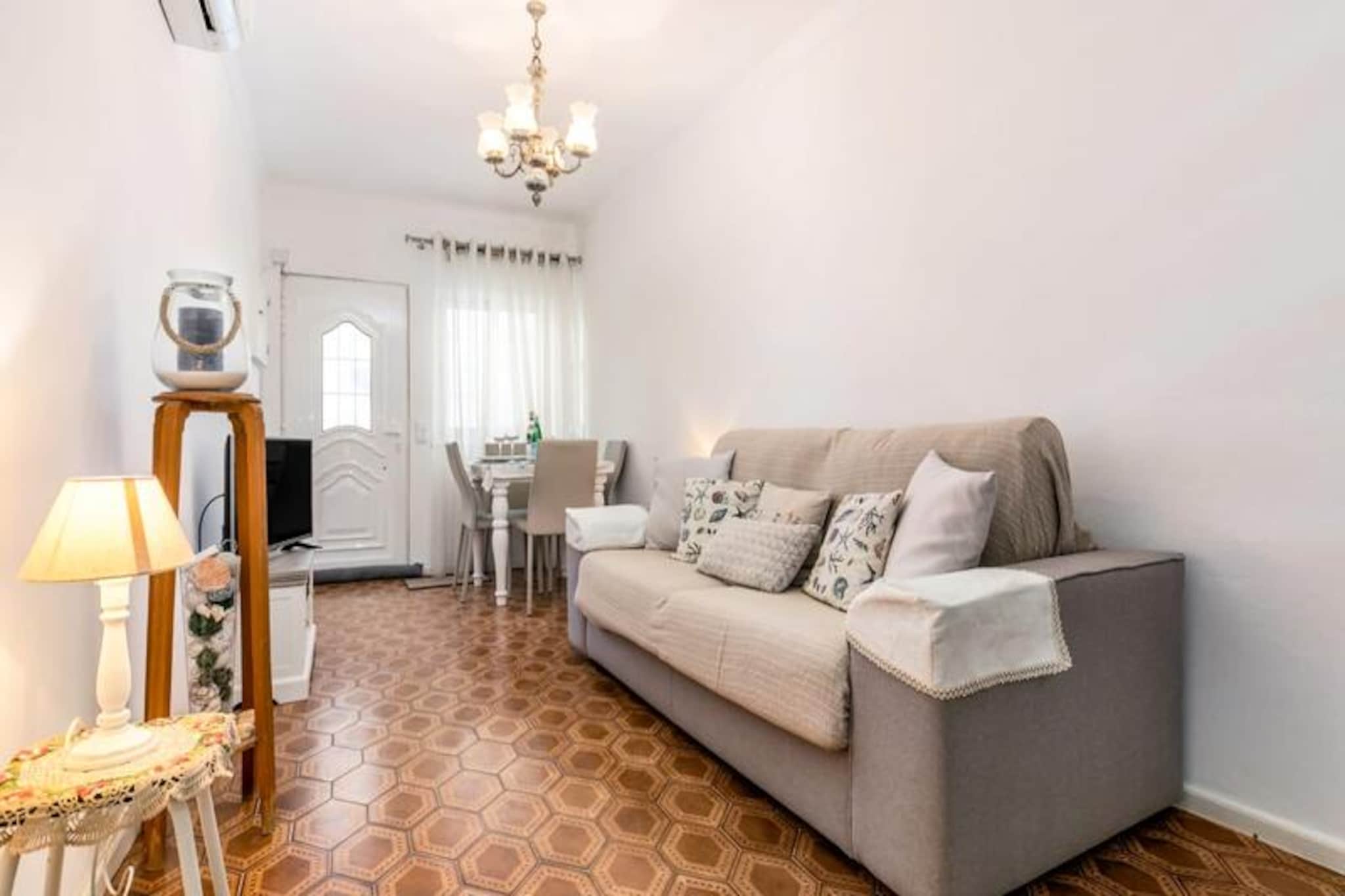 In the heart of Albufeira's charming Old Town, this delightful traditional house offers a serene escape just moments from the golden sands of the Algarve coast. Tucked away on a quiet cul-de-sac, this property combines the character of Portuguese architecture with the comforts of modern living, making it an ideal retreat for couples or small families seeking a memorable seaside getaway. With two terraces offering breathtaking ocean views, you’ll find the perfect spot to relax and soak in the beauty of the surroundings. 

The house spans three floors, thoughtfully designed to maximize comfort and functionality. On the ground floor, you’ll find a cozy living and dining area with a sofa bed, alongside a fully equipped kitchen that invites you to prepare delicious meals. The second floor features a tranquil bedroom with two single beds that can be joined to form a double, as well as an en-suite bathroom. Step out onto the first terrace to enjoy al fresco dining with a barbecue and stunning sea views. A spiral staircase leads to the rooftop terrace, where sun loungers await for ultimate relaxation under the Algarve sun. 

Located just a short stroll from the beach, the house is surrounded by a vibrant array of shops, restaurants, and bars, offering the best of Albufeira’s lively atmosphere. Despite its central location, the property is nestled in a peaceful residential area, ensuring a restful stay. Please note that the steep spiral staircase may not be suitable for young children or guests with mobility issues. 

Whether you’re savoring fresh seafood at a nearby eatery, exploring the cobbled streets of the Old Town, or simply unwinding on the terrace with a glass of wine, this house provides the perfect base for an unforgettable Algarve holiday. Let the ocean breeze and the charm of Albufeira make your stay truly special.