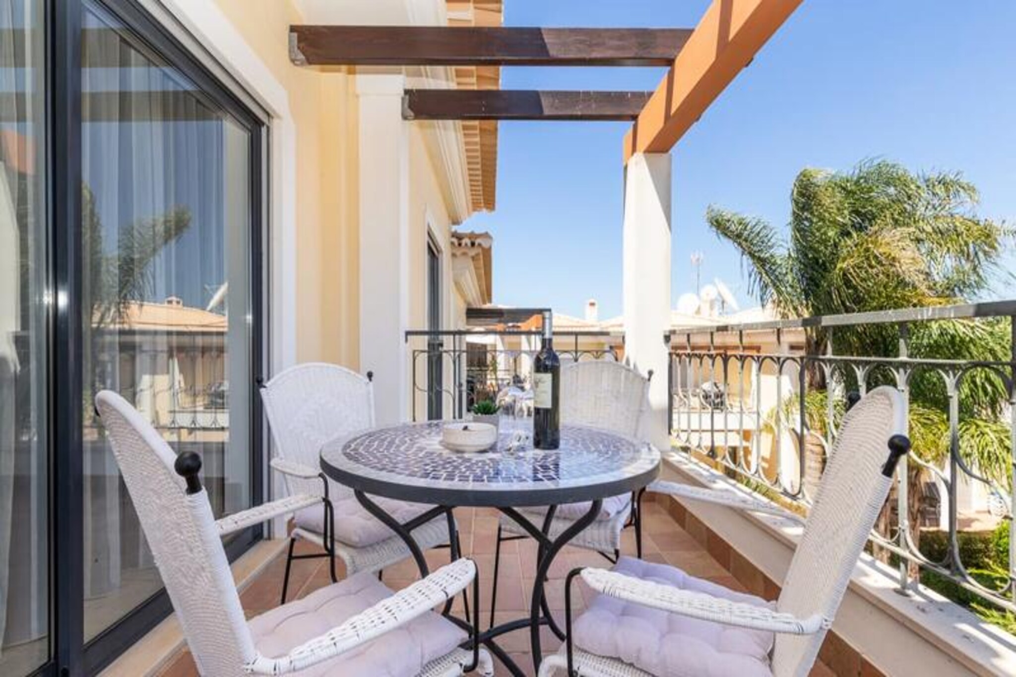 Perched above the golden cliffs of Porto de Mos, this modern two-bedroom apartment offers a serene coastal retreat just minutes from the vibrant heart of Lagos. Imagine waking up to the sound of waves and enjoying your morning coffee on the spacious balcony, with the Atlantic Ocean as your backdrop. Whether you're here for a family getaway or a romantic escape, this property combines tranquility with easy access to the region's most iconic attractions.
Step inside and discover a bright, airy space designed for comfort and relaxation. The master bedroom features a luxurious king-size bed and an ensuite bathroom, while the second bedroom offers two cozy single beds. A small double sofa bed in the living area provides additional sleeping space, making it ideal for up to six guests. The fully equipped kitchen invites you to prepare delicious meals, while the shared swimming pool offers a refreshing alternative to the nearby beach. Modern amenities like Wi-Fi, a television, and fresh linens ensure a hassle-free stay.
Just a five-minute walk away, Porto de Mos beach beckons with its golden sands and crystal-clear waters. The dramatic cliffs of Ponta da Piedade, perfect for hiking or photography, are also within easy reach. For dining, you'll find excellent beachfront restaurants and charming local eateries in the nearby residential area. A short drive or walk takes you to Lagos' historic center, where cobblestone streets, lively markets, and a bustling marina await.
Whether you're exploring the Algarve's stunning coastline, indulging in fresh seafood, or simply soaking up the sun, this apartment offers the perfect base for an unforgettable holiday. Book your stay today and experience the magic of Lagos!