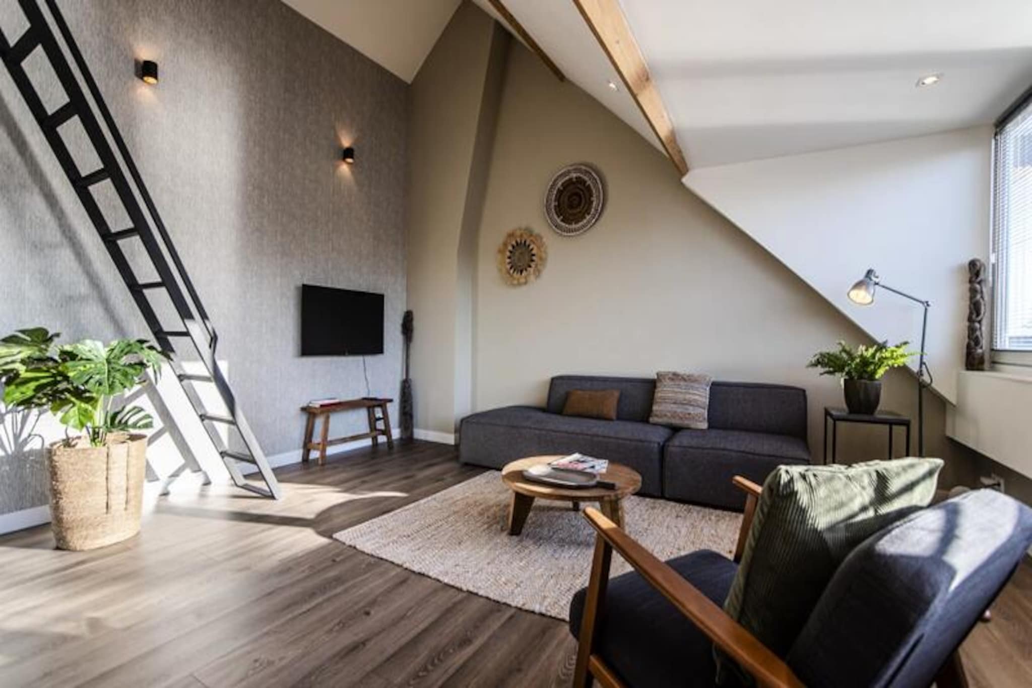 In the heart of Zandvoort, where the charm of a seaside village meets modern convenience, this recently renovated loft offers a perfect retreat for those seeking both relaxation and adventure. Just a short stroll from the vibrant town center and a 10-minute walk to the sandy shores and bustling boulevard, this property combines the best of coastal living with easy access to city life. With Amsterdam Central Station only 30 minutes away by train, you can effortlessly explore the cultural treasures of the Dutch capital while enjoying the tranquility of the beach.
This bright and stylish loft is located on the top floor of a two-story residential house, offering complete privacy for up to three adults and one child. The interior is tastefully designed with modern furnishings and all the comforts of home, including a fully equipped kitchen and a private bathroom. The open layout creates a spacious and welcoming atmosphere, perfect for unwinding after a day of exploring. Please note, the stairs leading to the loft are steep, adding a touch of authentic Dutch character to your stay.
Zandvoort itself is a lively seaside destination with a variety of shops, restaurants, and bars just minutes from your doorstep. For nature enthusiasts, the surrounding national parks, De Waterleidingduinen and Kennemerduinen, offer stunning trails for walking and cycling. Whether you prefer a leisurely beach day, an adventurous surf session, or a scenic bike ride, there’s something for everyone. The nearby Circuit Park Zandvoort adds a unique thrill, hosting motorsport events and even offering the chance to earn a racing license.
This loft is more than just a place to stay; it’s a gateway to unforgettable experiences. From the serene beauty of the dunes to the vibrant energy of Amsterdam, your perfect Dutch getaway starts here. Let the blend of coastal charm and urban excitement create memories you’ll cherish forever.