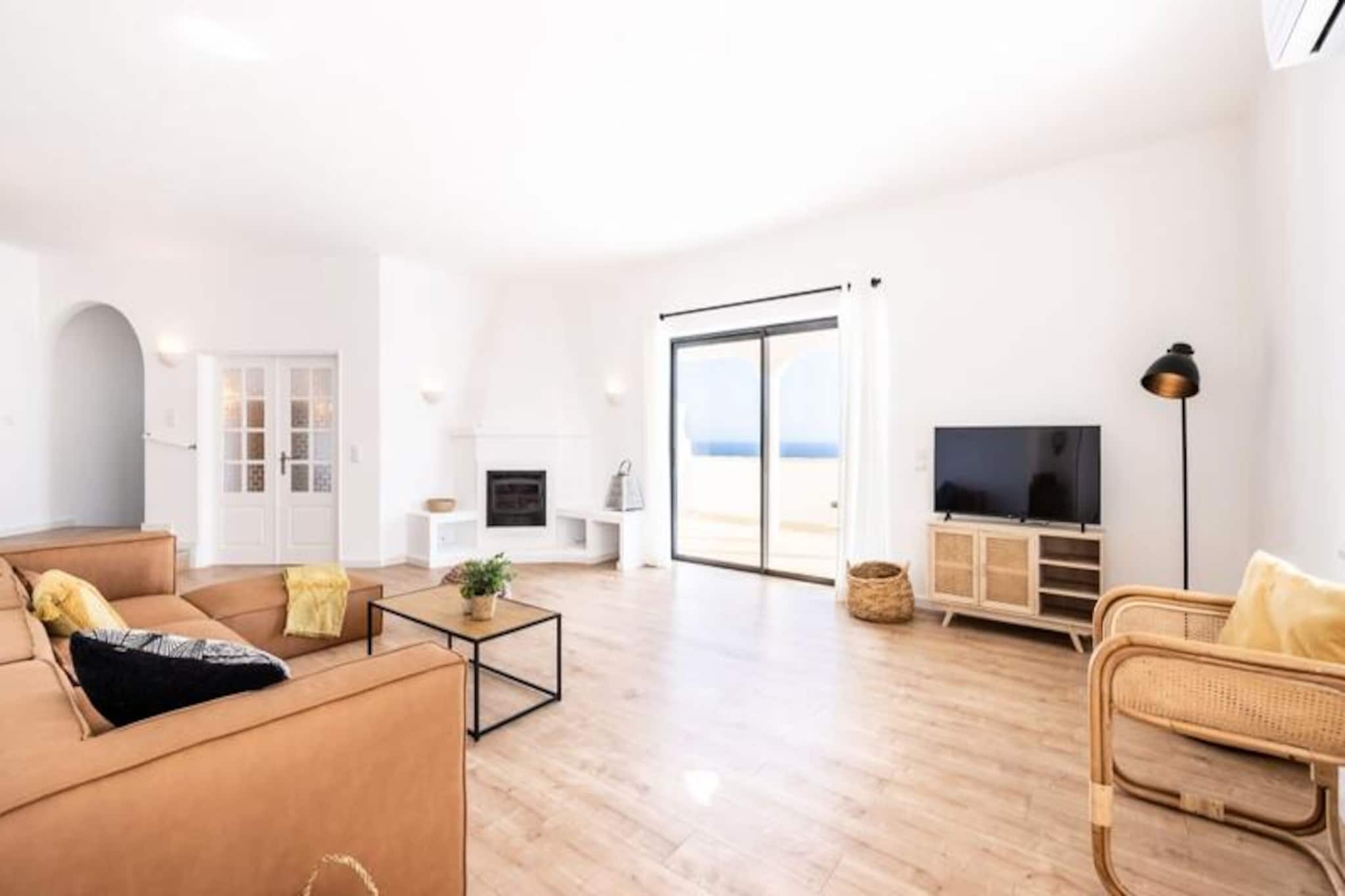 With its breathtaking views of the Algarve cliffs and the sparkling ocean, this serene two-bedroom apartment in Villa Miramar offers the perfect escape for families seeking relaxation and natural beauty. Situated between the picturesque fishing villages of Burgau and Salema, this fully renovated property combines modern comfort with the timeless charm of southern Portugal. Whether you’re lounging by your private pool or enjoying the golden hues of a coastal sunset from your balcony, every moment here is designed to rejuvenate the soul. 

The apartment is thoughtfully designed to provide a comfortable and stylish retreat. It features two spacious bedrooms, one with an en-suite bathroom and dressing room, and another bathroom conveniently located near the second bedroom. The open-plan living area connects seamlessly to a fully equipped kitchen, perfect for preparing meals to enjoy on the large balcony overlooking the sea. Modern amenities such as Wi-Fi, a dishwasher, and a washing machine ensure a hassle-free stay, while the private terrace and pool invite you to unwind in complete tranquility. 

Beyond the villa, the Algarve awaits with its stunning beaches, dramatic cliffs, and vibrant local culture. Praia do Burgau, nestled in a sheltered cove, is ideal for family outings or water sports like surfing and paddleboarding. The nearby town of Lagos offers a lively marina, historic charm, and a variety of shops and restaurants, just an 8 km drive away. For golf enthusiasts, three renowned courses are within a 15-minute drive, while nature lovers can explore scenic coastal trails and hidden coves. 

With its idyllic location, modern comforts, and proximity to the best of the Algarve, this apartment at Villa Miramar is your gateway to unforgettable family memories. Book your stay and experience the magic of Portugal’s southern coast.