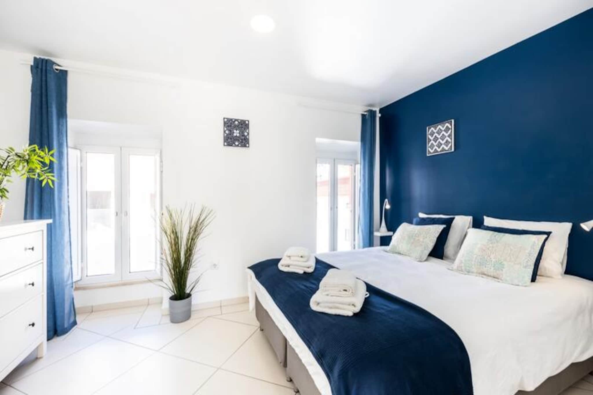 Immerse yourself in the vibrant charm of Albufeira’s Old Town with a stay at this delightful townhouse, perfectly positioned just a two-minute walk from the golden sands of Peneco and Pescadores beaches. Tucked away in a peaceful cul-de-sac, this property offers the best of both worlds: tranquility and proximity to the lively atmosphere of the city’s restaurants, shops, and bars. Whether you’re seeking a beachside escape or a cultural adventure, this home places you at the heart of it all. 
 
 This thoughtfully designed townhouse features two cozy bedrooms and two modern bathrooms, making it ideal for families or small groups. The fully equipped kitchen invites you to prepare delicious meals, while the dining area and living room with a flat-screen TV and cable channels provide the perfect space to unwind after a day of exploration. Step out onto the private terrace and enjoy panoramic views of the city, soaking in the unique ambiance of Albufeira. With air conditioning, free Wi-Fi, and all linens and towels provided, every detail has been considered to ensure your comfort. 
 
 The property’s prime location means you’re just steps away from the stunning Algarve coastline, where you can bask in the sun or take a refreshing dip in the Atlantic. Stroll through the cobbled streets of the Old Town, discovering hidden gems, local markets, and authentic Portuguese cuisine. For those looking to explore further, public transport and taxis are readily available, and car rentals offer easy access to the wider Algarve region. 
 
 Whether you’re drawn by the allure of the beach, the vibrant nightlife, or the rich cultural heritage, this townhouse offers a serene retreat amidst the excitement of Albufeira. Book your stay today and create unforgettable memories in one of Portugal’s most beloved destinations.