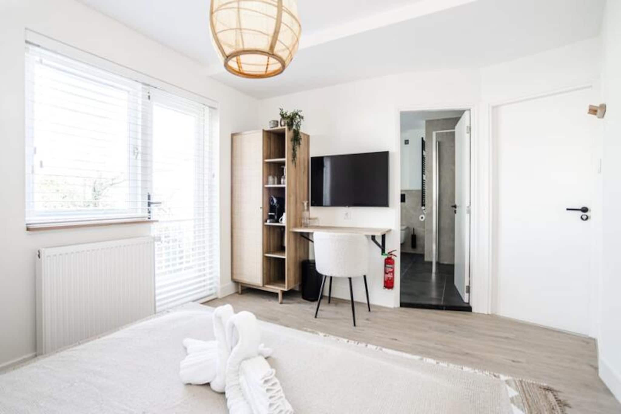 Welcome to Marley's Beachhouse, a serene hideaway in the charming coastal town of Zandvoort. Here, the rhythm of the waves and the soft golden sands create the perfect backdrop for a romantic escape, a peaceful solo retreat, or a memorable getaway with close friends. Just a short stroll from the dunes and beach, this luxurious bed and breakfast offers a harmonious blend of comfort and style, inviting you to unwind and reconnect with nature. 

Step into your private sanctuary, where every detail has been thoughtfully curated. The separate unit boasts a private entrance, a king-size bed adorned with freshly laundered linens, and an en-suite bathroom featuring both a bathtub and shower. The lounge area opens directly onto your private balcony, where you can sip your morning coffee or enjoy a glass of wine as the sun sets. With Wi-Fi, television, and all the essentials provided, your stay promises to be as convenient as it is relaxing. 

Zandvoort is a treasure trove of experiences waiting to be discovered. From moonlit beach walks to exploring the nearby national parks of De Waterleidingduinen and Kennemerduinen, the area is a haven for nature lovers. For thrill-seekers, Circuit Park Zandvoort offers exhilarating activities, while the town's vibrant beach clubs and restaurants provide a taste of local culture. And with Amsterdam just a short train ride away, you can effortlessly combine the tranquility of the coast with the excitement of the city. 

Whether you're here to relax, explore, or indulge, Marley's Beachhouse is your gateway to unforgettable moments. Reserve your stay today and let the magic of Zandvoort captivate you.