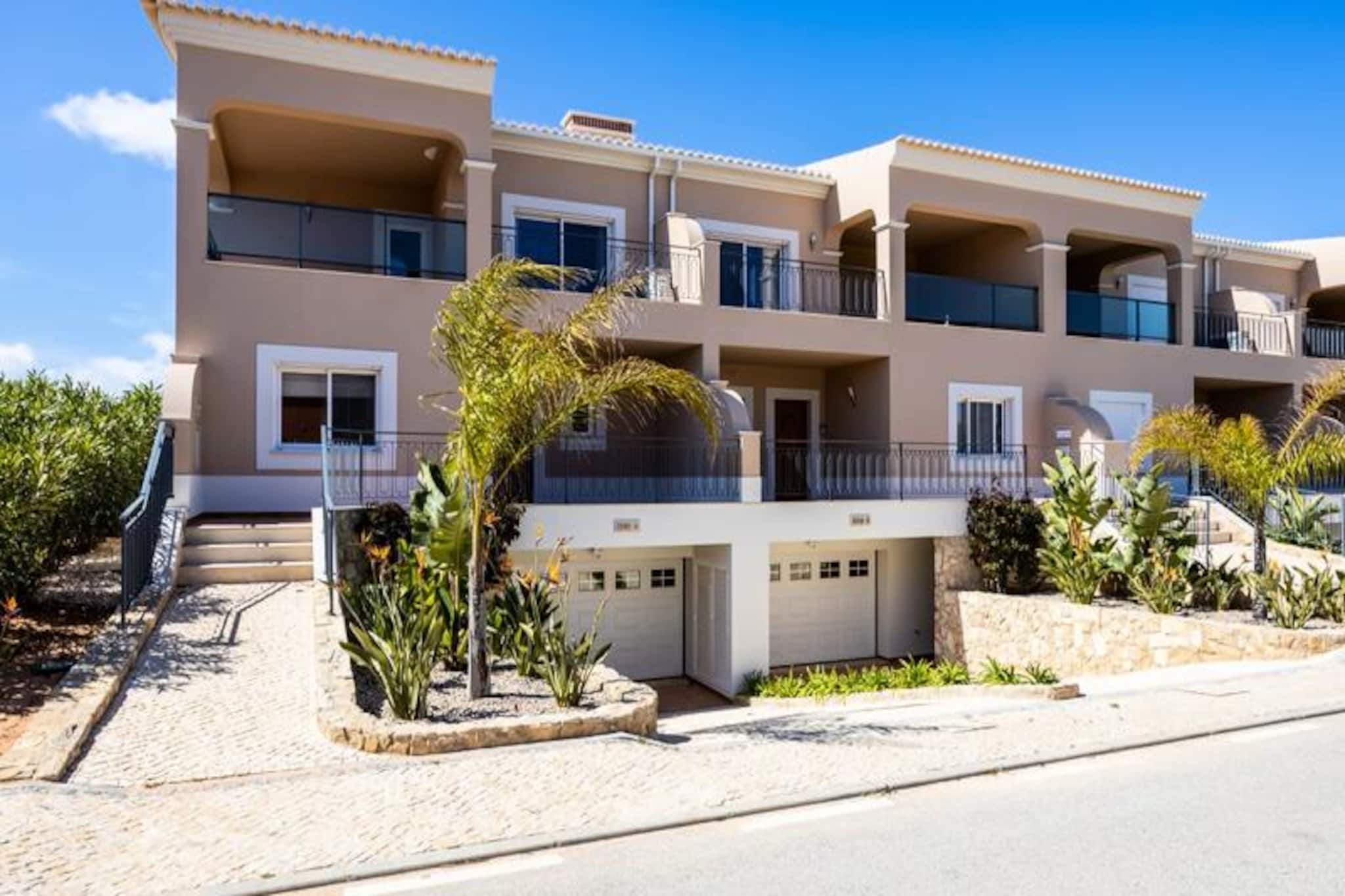 Imagine waking up to the serene beauty of the Algarve, where golden sunlight filters through your private balcony, and the lush greens of a world-class golf course stretch before you. This stylish townhouse, nestled within the exclusive Boa Vista Golf and Spa Resort, offers the perfect blend of relaxation and recreation, just minutes from the vibrant city of Lagos. Whether you’re seeking a peaceful retreat or an active holiday, this property caters to all your desires. 
 
 Step inside to discover a beautifully designed home with modern comforts and colorful décor that creates a warm and inviting atmosphere. With three spacious bedrooms, four bathrooms, and a separate office with a sofa bed, there’s ample space for families or groups of friends. The fully equipped kitchen and outdoor barbecue area make it easy to enjoy home-cooked meals, while the shared indoor and outdoor pools, sauna, and jacuzzi provide endless opportunities for relaxation. For those who love to stay active, the resort boasts tennis courts, a gym, and an 18-hole golf course. 
 
 Beyond the resort, the historic town of Lagos awaits with its cobbled streets, lively marina, and stunning cliffs. Take a boat or kayak tour to explore the breathtaking coastline, or indulge in the region’s renowned cuisine at one of the many local restaurants. The Algarve’s pristine beaches, water sports, and cultural attractions ensure there’s something for everyone. 
 
 Whether you’re here to unwind by the pool, perfect your golf swing, or explore the wonders of the Algarve, this townhouse offers an unforgettable escape. Book your stay today and create memories that will last a lifetime.