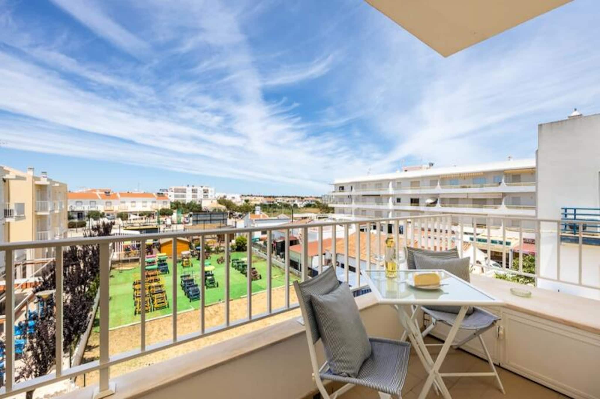 In the tranquil Algarve region, where golden sands meet azure waters, this charming 2-bedroom apartment in Altura Beach offers the perfect retreat for a rejuvenating holiday. Whether you're a couple seeking a romantic escape or a small family looking for seaside adventures, this cozy haven promises comfort and relaxation in equal measure. Wake up to the gentle sound of waves and enjoy the serene ambiance of this coastal gem. 
 
 The apartment features a thoughtfully designed living area with a dedicated TV space and a spacious dining table, ideal for shared meals or game nights. Step out onto the balcony to savor your morning coffee or an evening glass of wine while soaking in the picturesque views and refreshing sea breeze. The semi-open kitchen is fully equipped with modern appliances, including a washing machine, microwave, oven, stove, kettle, and coffee maker, ensuring all your culinary needs are met. 
 
 The two inviting bedrooms are tailored for restful nights: one with a plush double bed and the other with two comfortable single beds, making it a perfect choice for families or friends. A well-appointed bathroom with a bathtub completes the layout, offering convenience and ease. 
 
 Beyond the apartment, the Algarve's natural beauty awaits. Explore the pristine beaches, the nearby Ria Formosa Natural Park, or the charming town of Tavira, just a short drive away. Whether you prefer kayaking, paddleboarding, or simply basking in the sun, this location offers endless opportunities for leisure and adventure. 
 
 Book your stay at Altura Beach today and immerse yourself in the Algarve's coastal charm. With its inviting interiors, prime location, and proximity to unspoiled beaches, this apartment is your gateway to unforgettable memories.