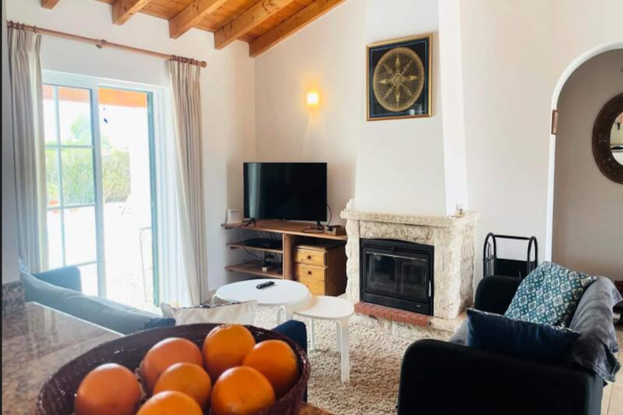 Imagine waking up to the serene sounds of nature, with the breathtaking Southwest Alentejo and Vicentine Coast Natural Park just a short walk away. This charming 3-bedroom villa in Vale da Telha offers the perfect blend of tranquility and adventure, surrounded by lush greenery and stunning coastal views. Just a 7-minute drive from the pristine beaches of Monte Clérigo, Amoreira, and Arrifana, this property is a haven for beach lovers, surfers, and nature enthusiasts alike. The iconic Ribat da Arrifana and the scenic Rota Vicentina hiking trails are also within easy reach, making this an ideal base for exploring the region's natural beauty. 
 
 Step inside and be greeted by a warm and inviting space. The villa features a spacious living room with high wooden ceilings, a cozy lounge area, and a dining space that seamlessly connects to a fully equipped open-plan kitchen. The kitchen opens onto the outdoor area, where you'll find a BBQ, a garage, and a beautifully landscaped garden with a secluded swimming pool. The house comfortably accommodates up to six guests, with three bedrooms offering built-in wardrobes, including one en-suite bedroom overlooking the pool. For larger groups, the villa can host up to eight, though the indoor spaces are optimized for six for maximum comfort. 
 
 Outside, the private garden and pool area provide a peaceful retreat, perfect for unwinding after a day of exploration. The villa's location at the end of a cul-de-sac ensures privacy and minimal traffic, making it an ideal choice for families or small groups seeking a relaxing getaway. 
 
 With the charming town of Aljezur just 6 km away, offering traditional restaurants, shops, and supermarkets, and the vibrant Algarve towns of Lagos and Portimão within easy driving distance, this villa is perfectly positioned for both relaxation and adventure. Whether you're here to surf, hike, or simply soak up the sun, this property promises an unforgettable holiday experience.