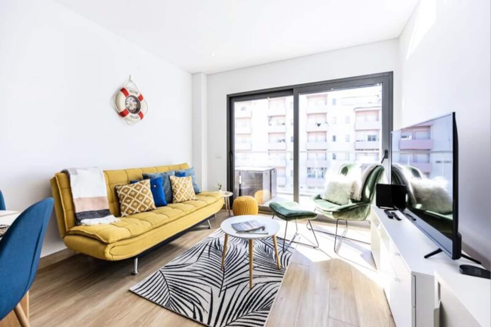Bask in the golden glow of the Algarve with this stunning one-bedroom apartment in the heart of Portimão. Just a short 10-minute stroll from the renowned Praia da Rocha, this modern retreat offers the perfect blend of comfort and convenience. Whether you're here to unwind by the sea, explore the vibrant local culture, or simply relax in a serene setting, this property is your gateway to an unforgettable holiday experience. 

Step inside to discover a bright and spacious open-plan living area that seamlessly connects to a large private balcony. Here, you can enjoy al fresco dining or morning coffee while soaking up the sunshine. The fully equipped kitchen comes with everything you need to prepare delicious meals, including a refrigerator, stove, oven, microwave, and coffee maker. The bedroom features a plush queen-size bed, while the living room offers a comfortable sofa bed, making it ideal for couples or small groups. Modern amenities like Wi-Fi, TV, and air conditioning ensure a worry-free stay. 

The apartment is part of a well-maintained residential complex with a shared swimming pool and garden, perfect for lazy afternoons under the sun. Private parking is available, allowing you to explore the Algarve at your leisure. Nearby, you'll find a variety of shops, bars, and restaurants, as well as easy access to public transport for day trips to other charming towns and attractions. 

Whether you're visiting for the pristine beaches, the lively nightlife of Praia da Rocha, or the family-friendly attractions like Zoomarine and local water parks, this apartment is your ideal home base. Book now and let the Algarve's beauty and charm captivate you.