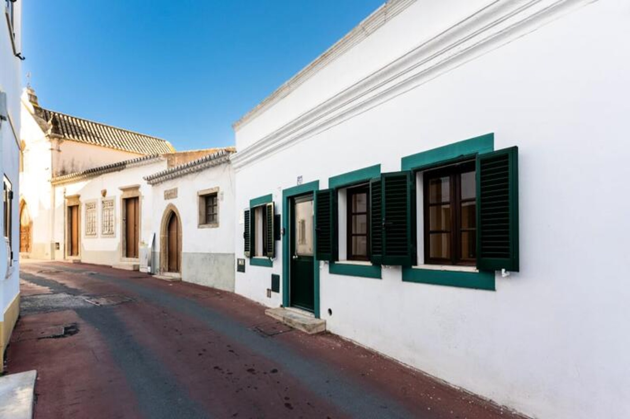 In the heart of Albufeira's historic center, Casa dos Sonhos invites you to experience the perfect blend of modern comfort and traditional Portuguese charm. This beautifully renovated family home, just steps from the vibrant streets and a short drive to the golden sands of Albufeira’s main beach, offers a serene retreat amidst the lively atmosphere of the Algarve. Imagine starting your day with a coffee on the rooftop terrace, bathed in the warm morning sun, or ending it with a glass of wine under the starry sky. 

Accommodating up to six guests, this three-bedroom, three-bathroom house is thoughtfully designed for families or small groups. The interior combines contemporary elegance with coastal-inspired touches, creating a bright and airy space. Each air-conditioned bedroom ensures restful nights, while the open-plan living and dining area flows seamlessly into a charming patio. The fully equipped kitchen is perfect for preparing meals, and the rooftop terrace provides an idyllic setting for al fresco dining or simply unwinding with panoramic views. 

Step outside, and you’ll find yourself surrounded by Albufeira’s rich history, cobblestone streets, and an array of restaurants, shops, and bars. The nearby beaches, with their golden sands and turquoise waters, are perfect for sunbathing, swimming, or exploring the dramatic cliffs of the Algarve coastline. For those looking to venture further, the region offers countless attractions, from picturesque villages to world-class golf courses. 

Whether you’re seeking relaxation, adventure, or a taste of Portuguese culture, Casa dos Sonhos is your gateway to an unforgettable Algarve escape. Book your stay today and create lasting memories in this enchanting seaside haven.