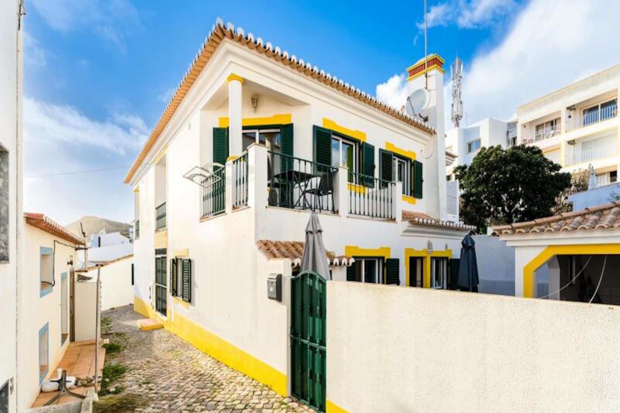 In the heart of the picturesque fishing village of Burgau, this charming apartment offers a tranquil escape just moments from the golden sands of the Algarve coast. With its cobblestone streets, whitewashed houses, and the soothing sound of waves in the background, Burgau is the perfect blend of traditional charm and coastal serenity, making it an ideal destination for couples seeking a peaceful retreat. 
 
 This cozy one-bedroom apartment is thoughtfully designed to provide both comfort and convenience. Located on the first floor with a private entrance, it features a spacious living area that opens onto a private balcony, perfect for enjoying a morning coffee or unwinding after a day at the beach. The bedroom boasts a luxurious king-size bed to ensure restful nights, while the fully equipped kitchen, complete with modern appliances and granite countertops, invites you to prepare delicious meals with fresh local ingredients. Wi-Fi and TV are also provided, ensuring you stay connected and entertained throughout your stay. 
 
 Burgau’s charm lies in its simplicity. Just a short stroll away, you’ll find a pristine beach sheltered by dramatic cliffs, as well as a selection of seaside restaurants serving freshly caught seafood. For those eager to explore, nearby beaches and the stunning coastline of the Algarve offer endless opportunities for adventure, from hiking and water sports to discovering hidden coves. While public transport is limited, a rental car will allow you to uncover the region’s treasures at your own pace, with free street parking available in the village. 
 
 Whether you’re looking to relax by the sea, savor the flavors of Portugal, or explore the natural beauty of the Algarve, this apartment in Burgau is your perfect home away from home.