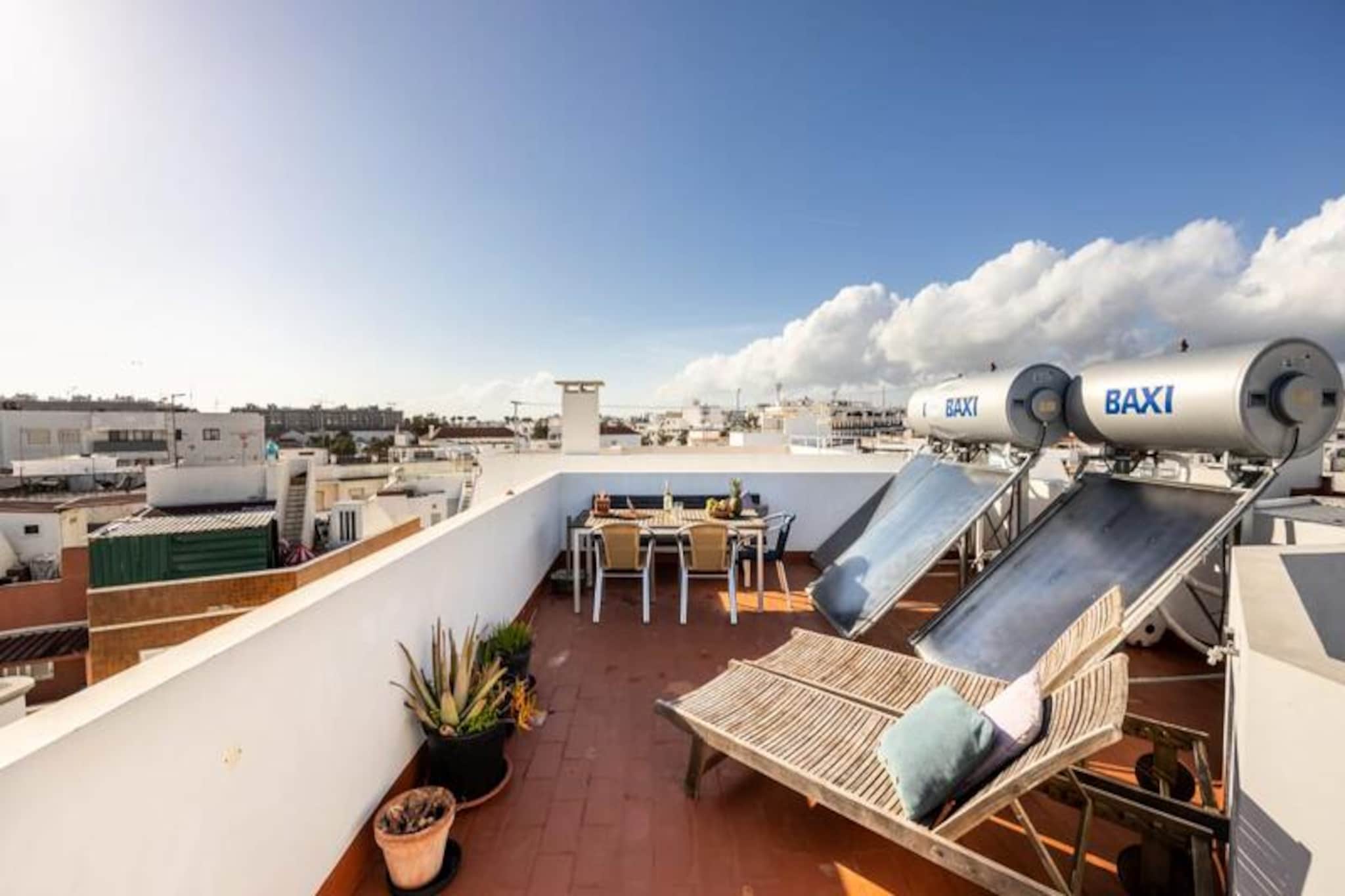 In the heart of Olhão, a picturesque fishing town near Faro, this charming studio invites you to experience the authentic Algarve lifestyle. Surrounded by cobblestone streets and vibrant local culture, the property offers a peaceful retreat while being just steps away from the town’s bustling center. Whether you’re exploring the nearby islands of Armona and Culatra or savoring fresh seafood at a traditional restaurant, this studio is the perfect base for your Algarve adventure.  
                       Located on the ground floor of a recently renovated house, the Armona studio boasts a private entrance and a thoughtfully designed layout. The sleeping area is subtly separated from the living space, creating a cozy yet functional atmosphere. The kitchenette is fully equipped with a two-burner induction cooktop, microwave, refrigerator, and dishwasher, ensuring you have everything needed for a comfortable stay. Modern amenities such as Wi-Fi and air conditioning enhance your experience, while a large rear window provides natural ventilation and light. Guests also have access to a shared patio, ideal for enjoying a morning coffee or unwinding after a day of exploration.  
                       Olhão is renowned for its proximity to the stunning islands of Armona and Culatra, accessible via ferry just a short walk from the property. These tranquil havens offer pristine beaches, crystal-clear waters, and a chance to immerse yourself in nature. The town itself is a treasure trove of history and culture, with lively markets, charming shops, and a variety of restaurants serving local delicacies. A large supermarket is conveniently located less than five minutes away, and public transport options make it easy to explore the wider Algarve region.  
                       Whether you’re a solo traveler or a couple seeking a romantic escape, this studio combines comfort, convenience, and a touch of local charm. Discover the beauty of Olhão and the Algarve from this welcoming retreat, where every detail is designed to make your stay unforgettable.