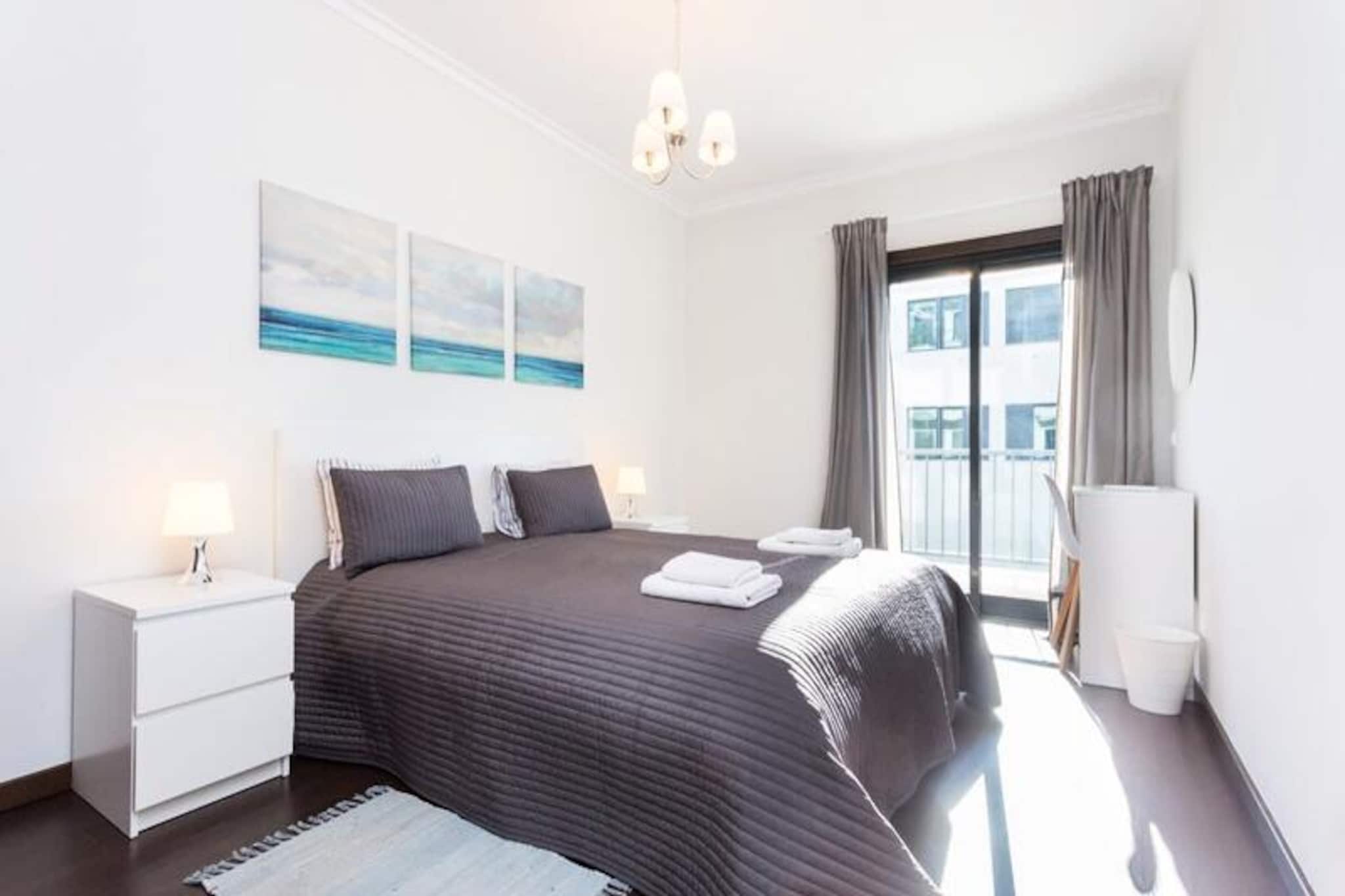 In the heart of Lagos, where the golden Algarve coastline meets vibrant city life, Casa da Marina offers a modern and tranquil retreat for your next getaway. This stylish one-bedroom apartment is designed with comfort and elegance in mind, making it the perfect choice for couples or small families seeking a blend of relaxation and adventure. Imagine starting your day with a coffee on the balcony, watching the sun rise over the marina, and ending it with breathtaking sunset views from the same spot. 
 
 The apartment features a spacious layout with a fully equipped kitchen, ideal for preparing fresh local dishes after a day of exploring. The bedroom boasts a luxurious double bed (1.60 x 2.00 m) for restful nights, while the living spaces are bright and airy, with access to balconies that invite the outdoors in. Guests can also enjoy the rooftop communal area, complete with a swimming pool and gym, perfect for unwinding or keeping active during your stay. 
 
 Step outside, and you’ll find yourself within walking distance of Lagos’ historic center, bustling marina, and stunning beaches. Wander through cobblestone streets lined with shops, cafes, and restaurants, or embark on a boat tour to explore the dramatic cliffs and caves that define the Algarve coastline. For those looking to venture further, the Monchique mountains and Sagres, the southwesternmost point of Europe, are just a short drive away. 
 
 Whether you’re here to soak up the sun, indulge in water sports, or immerse yourself in Portuguese culture, Casa da Marina is your gateway to an unforgettable holiday experience. With modern amenities, a prime location, and a touch of luxury, this apartment promises to be your home away from home in Lagos.