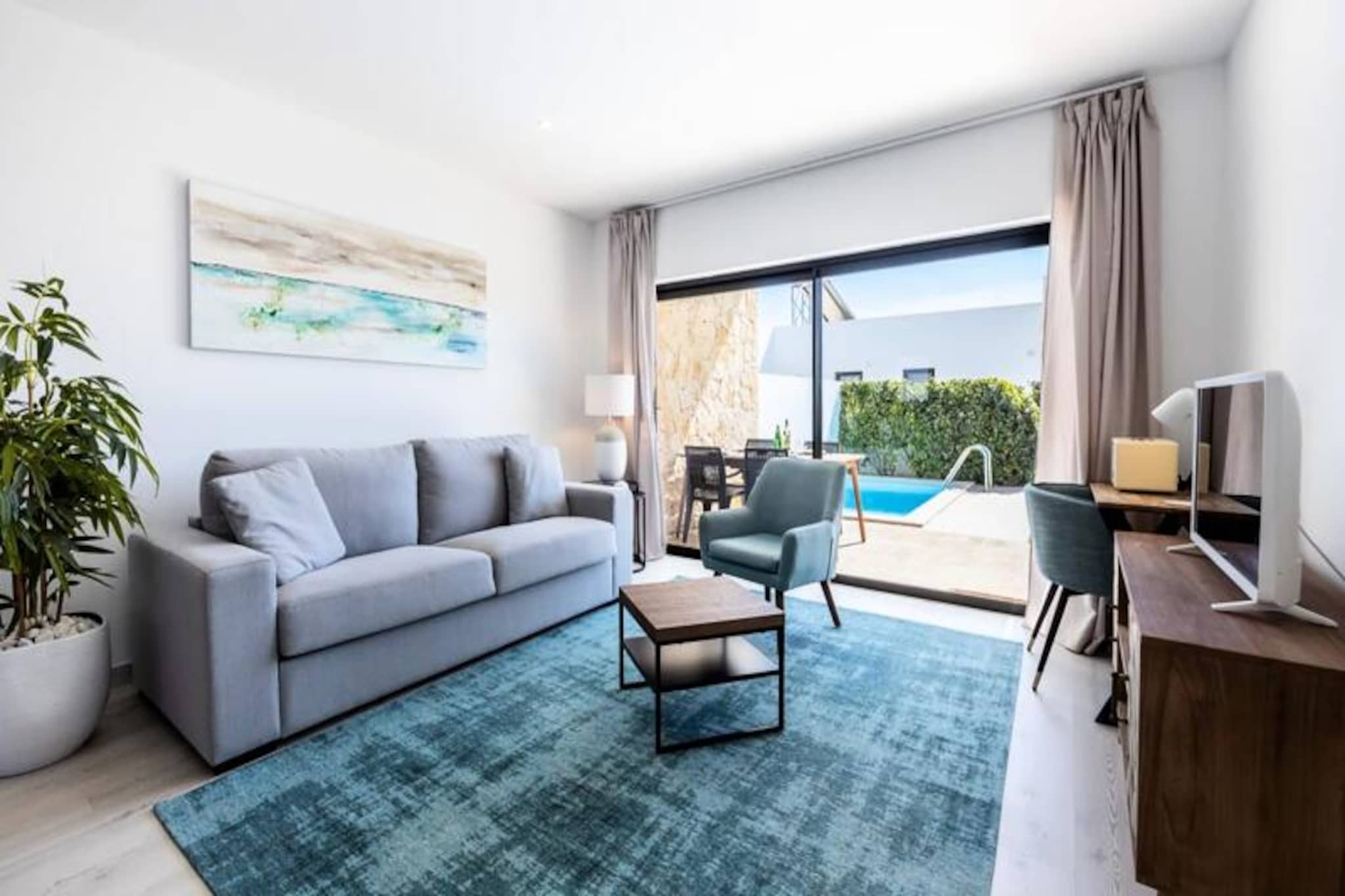 In the serene coastal town of Sagres, where the Atlantic meets dramatic cliffs, this charming holiday home offers the perfect retreat for up to four guests. With a private garden and a refreshing swimming pool, it’s an oasis of calm just a short distance from the golden sands of Martinhal and Tonel beaches. Whether you’re seeking relaxation or adventure, this property provides an ideal base to experience the best of Portugal’s Algarve region.
Step inside to discover a bright and inviting living space that overlooks the lush garden and pool. The living room is thoughtfully designed with a comfortable sofa, satellite TV, and a dining area for four, creating a cozy atmosphere for unwinding after a day of exploration. The open-plan kitchen is fully equipped with modern appliances, including a ceramic hob, microwave, oven, fridge/freezer, and dishwasher, ensuring you have everything you need to prepare delicious meals.
The home’s location is unbeatable, with the Intermarché supermarket, local restaurants, and surf shops just a short stroll away. For those eager to explore, the town center of Sagres is only 1 km away, offering a range of markets, bars, and medical services. Outdoor enthusiasts will delight in the nearby opportunities for surfing, diving, hiking, and cycling, while families can enjoy day trips to Lagos, the Santo António golf course, or the Slide & Splash Water Park.
With private parking and easy access to public transport, this holiday home combines convenience with tranquility. Whether you’re soaking up the sun by the pool, venturing to the nearby beaches, or exploring the rugged beauty of the Algarve, this property promises an unforgettable stay. Book now and create lasting memories in this idyllic coastal escape.