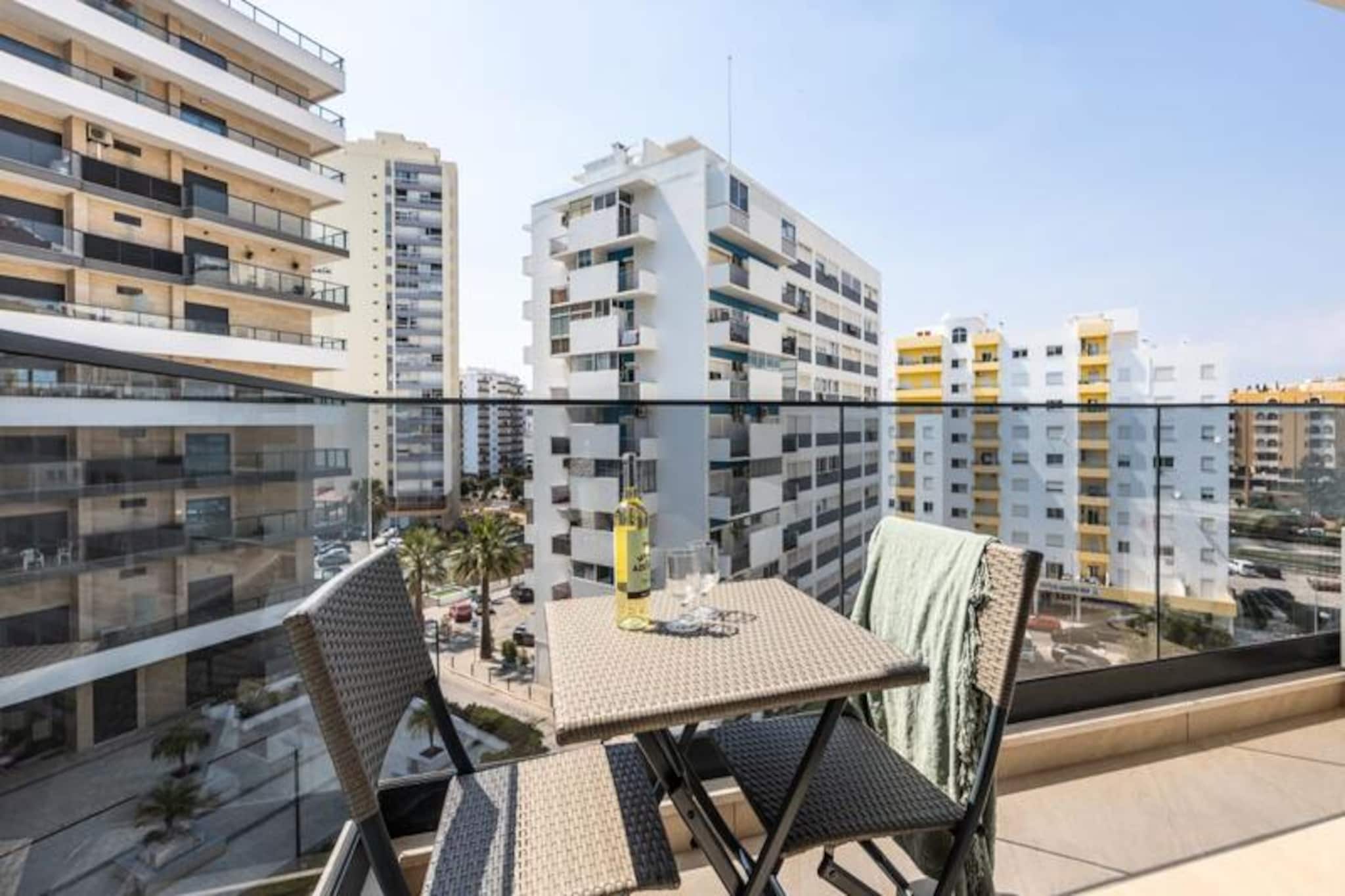 Imagine waking up to the soothing sound of waves and stepping out onto your private balcony to bask in the golden Algarve sunshine. This modern one-bedroom apartment, completed in 2023, is a true gem in the heart of Praia da Rocha, offering the perfect blend of comfort, style, and unbeatable location. Whether you're here for a romantic getaway or a peaceful retreat, this apartment is designed to make your stay unforgettable. 

Inside, you'll find a bright and airy space with contemporary furnishings and thoughtful touches throughout. The fully equipped kitchen allows you to prepare delicious meals, while the cozy living area invites you to unwind after a day of exploration. The bedroom is a serene haven, complete with plush linens and ample storage. With Wi-Fi, television, and air conditioning, every detail has been considered to ensure your comfort. The apartment also features a private balcony where you can sip your morning coffee or enjoy an evening glass of wine as the sun sets over the horizon.

Step outside, and you'll find yourself just moments from the golden sands of Praia da Rocha beach. Stroll along the vibrant promenade lined with shops, restaurants, and bars, or venture further to discover the natural beauty and cultural treasures of the Algarve. For families, the nearby Zoomarine water park and Lagos Zoo offer fun-filled days, while couples can explore the charming streets of Portimão or take a scenic drive along the coastline. With private parking and easy access to public transport, the entire region is at your fingertips.

Book your stay today and experience the magic of Praia da Rocha. Whether you're here to relax, explore, or indulge in the local cuisine, this apartment is your perfect home away from home.