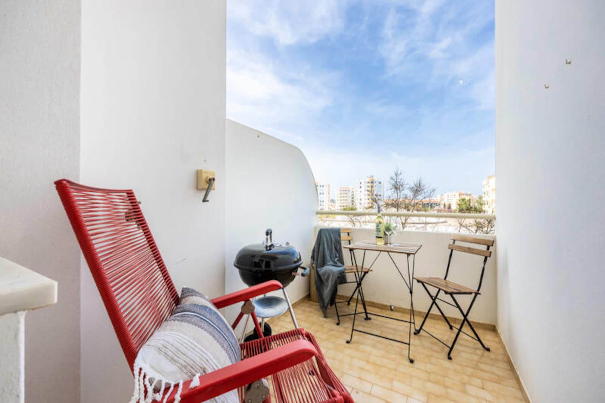 In the heart of the Algarve, this recently renovated two-bedroom apartment offers a serene retreat just a short walk from the vibrant historic center of Lagos. Whether you're seeking sun-soaked beaches, cultural exploration, or a peaceful escape, this charming accommodation provides the perfect base for your holiday. Imagine starting your day with a leisurely stroll to Praia Dona Ana or Praia do Porto de Mos, both within a 15-20 minute walk, where golden sands and azure waters await. 
 
 The apartment comfortably accommodates up to six guests, featuring a master bedroom with a double bed, a second bedroom with two single beds, and a modern living area with a sofa bed. The fully equipped kitchen opens onto a cozy balcony with a barbecue, ideal for enjoying warm Algarve evenings. The living room also leads to a second balcony, where you can relax and soak in the afternoon sun. Thoughtfully designed by the owners, the space combines modern amenities with a welcoming atmosphere, ensuring a comfortable and stylish stay. Wi-Fi, TV, and all necessary linens and towels are provided for your convenience. 
 
 Step outside, and you'll find a variety of local cafes, restaurants, and a bakery just a short walk away, offering a taste of authentic Portuguese cuisine. A small supermarket nearby makes it easy to stock up on essentials. For those eager to explore, the Algarve's stunning coastline and dramatic cliffs provide endless opportunities for hiking, cycling, and breathtaking views. Golf enthusiasts will appreciate the proximity to some of Europe’s finest courses, while surfers can head to the west coast for world-class waves. 
 
 With free parking available and excellent access to public transport, this apartment is perfectly situated to help you discover the best of Lagos and beyond. Whether you're a family, a couple, or a group of friends, this peaceful yet central location promises an unforgettable Algarve experience.