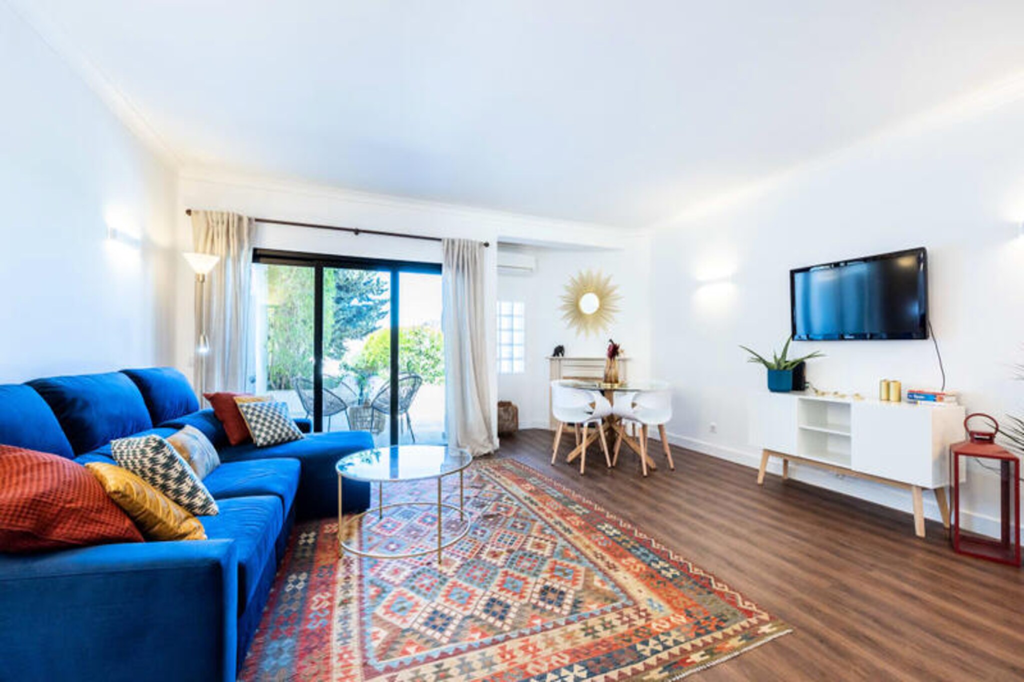 In the heart of the Algarve, where golden cliffs meet the azure waters of the Atlantic, CasAmar at Villa Gaivota offers a serene escape in the charming village of Ferragudo. This delightful 2-bedroom townhouse is a haven for families or couples seeking a blend of comfort, style, and the natural beauty of Portugal's coastline. Just a short walk from the pristine Caneiros Beach, this property is perfectly situated for a memorable holiday. 
 
 Step inside and be greeted by vibrant, colorful décor that brings a unique charm to every corner. The master bedroom features a plush double bed, while the second bedroom offers two cozy single beds, ideal for children or friends. A sofa bed in the living room provides additional sleeping space for two. With two modern bathrooms, a fully equipped kitchen, and a spacious living area, CasAmar ensures every comfort for your stay. The house is surrounded by lush gardens and boasts multiple terraces, allowing you to bask in the sun or relax in the shade at any time of day. 
 
 The location is a dream for beach lovers and food enthusiasts alike. Caneiros Beach, home to the renowned Rei das Praias restaurant, is just a short stroll away. Spend your days swimming in crystal-clear waters, exploring nearby Pintadinho and Mole beaches, or indulging in fresh seafood with a view. The charming village of Ferragudo, with its cobbled streets and local markets, is just a 2-minute drive, while the bustling city of Portimão is only 5 minutes away. 
 
 Whether you’re seeking adventure, relaxation, or a mix of both, CasAmar at Villa Gaivota is your perfect base to explore the Algarve. With its idyllic setting, modern amenities, and proximity to some of the region’s best attractions, this townhouse promises an unforgettable holiday experience.