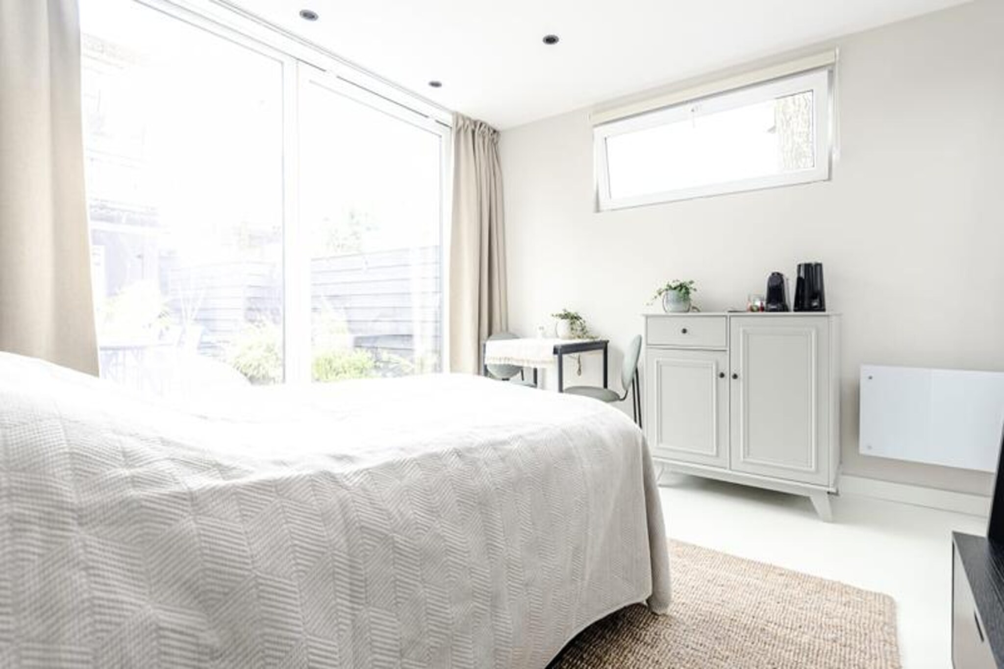 Step into a serene retreat in the picturesque town of Zandvoort, where the charm of the Dutch coast meets the tranquility of nature. This brand-new garden studio, designed exclusively for two, offers a perfect escape for couples or solo travelers seeking a peaceful getaway. Located directly opposite the breathtaking Amsterdam Dunes Nature Reserve, this property invites you to immerse yourself in the beauty of the surrounding landscapes while enjoying the comforts of modern living. \n\nThe studio is thoughtfully designed to provide everything you need for a relaxing stay. The cozy living space features a large, comfortable double bed and a private bathroom, ensuring convenience and privacy. The highlight of the property is the private terrace, where you can bask in the sun or enjoy a quiet evening under the stars. With amenities like Wi-Fi, fresh linens, and towels provided, your comfort is guaranteed. Additionally, the property offers a seamless parking reservation system to make your arrival stress-free.\n\nZandvoort is a destination that caters to all seasons. In the summer, indulge in the vibrant atmosphere of beach clubs and seaside restaurants, while winter offers a serene escape into nature. The town is surrounded by two stunning national parks, De Waterleidingduinen and Kennemerduinen, perfect for hiking, cycling, or even mountain biking. For adventure enthusiasts, the area offers surfing, kitesurfing, and diving opportunities. Motorsport fans will appreciate the proximity to Circuit Park Zandvoort, a renowned racing circuit hosting thrilling events year-round.\n\nConveniently located just 27 minutes by train from Amsterdam Central, Zandvoort is an ideal blend of seaside relaxation and city exploration. Whether you're here to unwind on the beach, explore the dunes, or experience the excitement of the racetrack, this charming studio provides the perfect base for your Dutch coastal adventure.