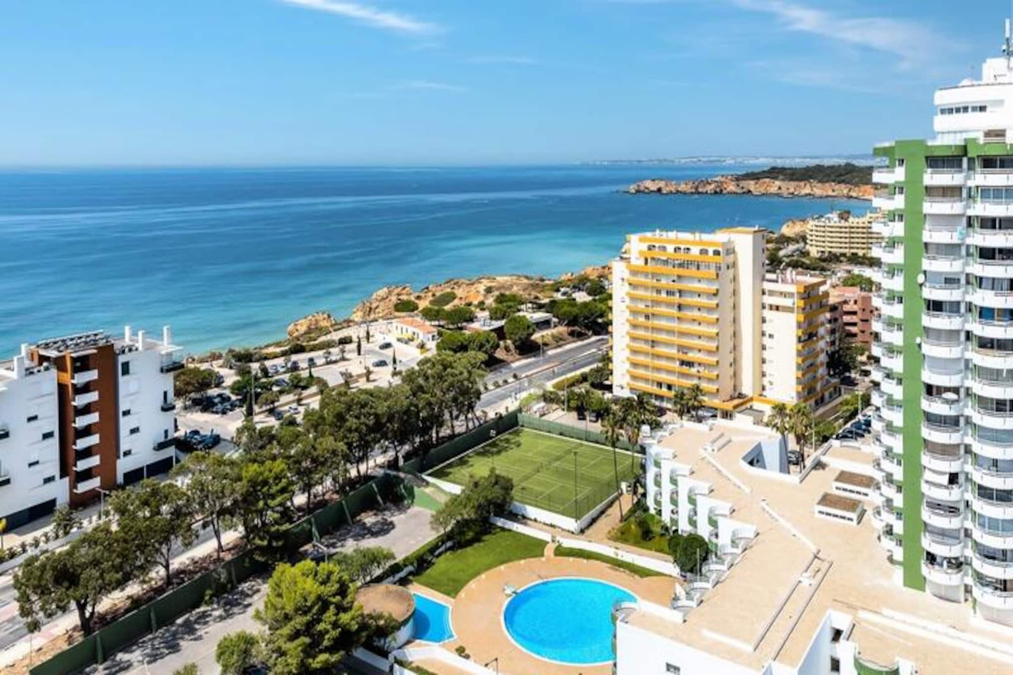 High above the golden sands of Praia dos Três Castelos, Vista Bonita offers a serene escape with panoramic views of the Atlantic Ocean, the Monchique mountains, and the vibrant city of Portimão. Perched on the 18th floor, this modern holiday apartment is your gateway to the Algarve’s endless beauty and charm, just 250 meters from one of the region’s most stunning beaches. Whether you’re seeking relaxation or adventure, this is the perfect base for your dream getaway. 
 
 Step inside and discover a bright, airy space designed for comfort and convenience. The apartment features two private balconies where you can sip your morning coffee while watching the sunrise or unwind with a glass of wine as the sun sets over the ocean. Modern amenities include air conditioning, automatic blinds, a Smart TV, Wi-Fi, and a fully equipped kitchen for preparing your favorite meals. The building also offers a seasonal swimming pool, a tennis court, and secure underground parking, ensuring a stress-free stay. 
 
 Vista Bonita’s location is second to none. A short stroll brings you to the lively Praia da Rocha boulevard, lined with restaurants, bars, and shops. For families, the nearby Zoomarine and water parks provide endless entertainment, while nature lovers can explore the dramatic cliffs and hidden coves of the Algarve coastline. With excellent transport links and free parking, you can easily explore the entire region, from the historic town of Lagos to the picturesque villages of the eastern Algarve. 
 
 Whether you’re traveling with family or friends, Vista Bonita promises a blend of comfort, convenience, and unforgettable views. Book your stay today and experience the magic of the Algarve from this stunning vantage point.