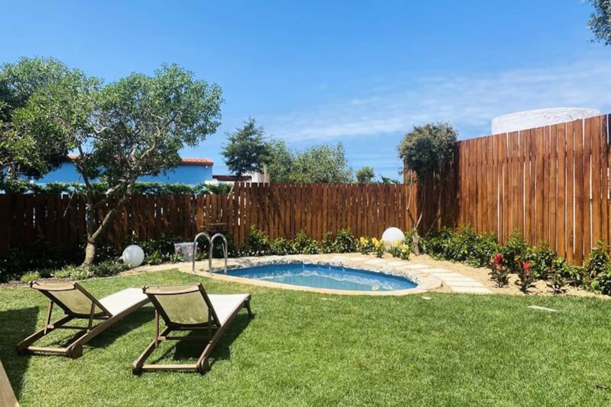 In the serene embrace of Sagres, where the Atlantic meets the rugged cliffs of Portugal’s southern coast, Casa Rainer offers an intimate retreat for couples seeking tranquility and adventure. Surrounded by the natural beauty of a protected park, this charming holiday home invites you to unwind and reconnect with nature. Wake up to the gentle sea breeze, explore the vibrant town center just a kilometer away, or bask in the golden sun on nearby surf beaches. Casa Rainer is your gateway to the Algarve’s untouched charm.
Designed with comfort in mind, this cozy home features a welcoming bedroom with a plush double bed, a fully equipped kitchen with modern appliances, and a comfortable living space perfect for relaxing after a day of exploration. Step outside to your private garden oasis, complete with a small swimming pool, barbecue area, and sun loungers. Whether you’re savoring a grilled meal under the stars or cooling off in the pool, every moment here is crafted for relaxation. Additional amenities such as Wi-Fi, cable TV, air conditioning, and secure private parking ensure a seamless stay.
Conveniently located, Casa Rainer is just 400 meters from a supermarket, surf shops, and a bus stop, while Sagres’ vibrant restaurants and bars are within walking distance. For the adventurous, the area offers world-class surfing, windsurfing, kayaking, and hiking trails. Don’t miss the iconic Cabo de São Vicente, known as the “end of the world,” a short drive away.
Whether you’re here to ride the waves, explore the dramatic coastline, or simply relax in the peaceful surroundings, Casa Rainer promises an unforgettable escape. Book your stay today and experience the magic of Sagres!