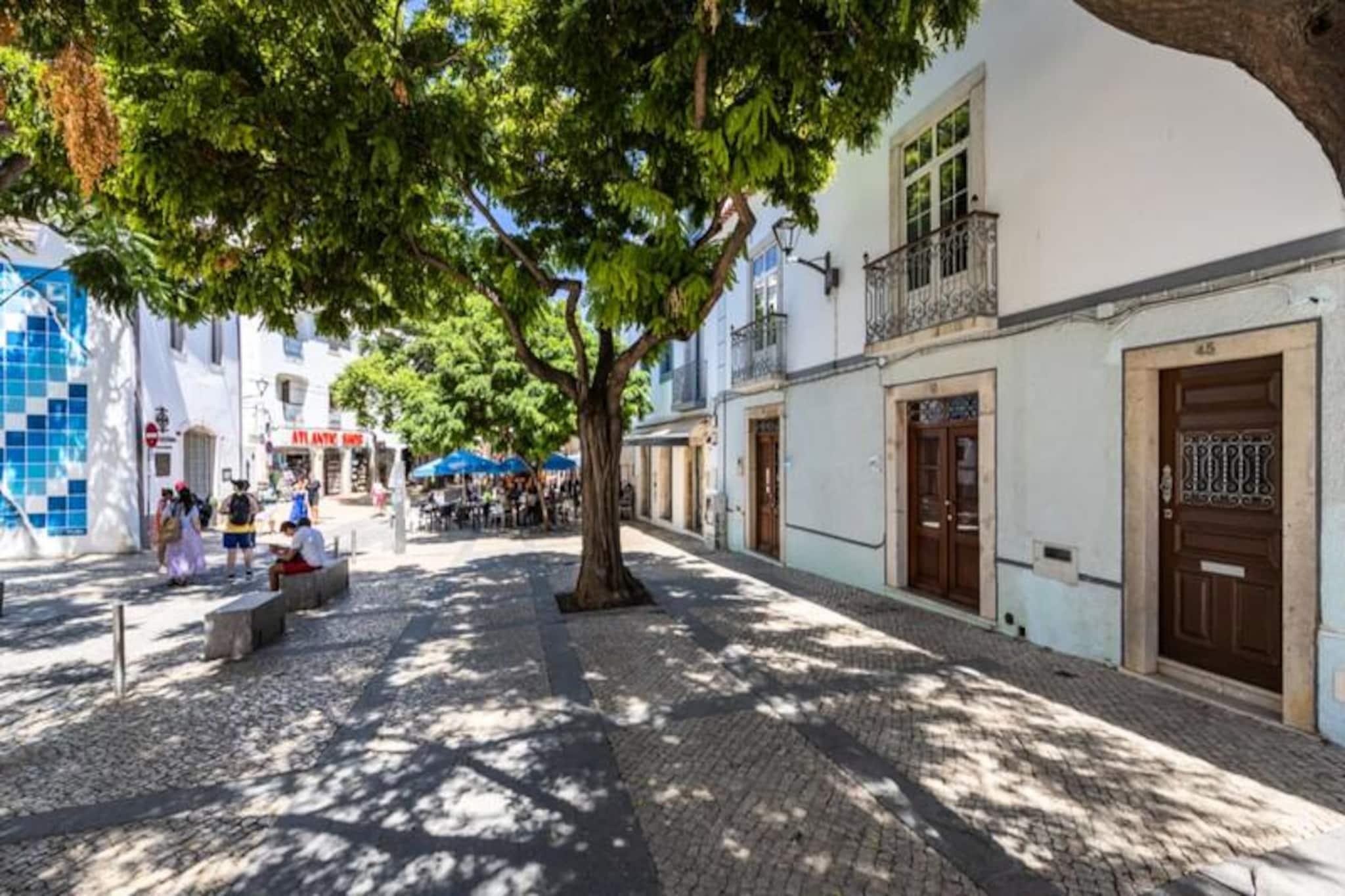 In the heart of Lagos' historic old town, this beautifully renovated 4-bedroom apartment offers a unique blend of charm and modern comfort. Picture yourself waking up to the soft sounds of the bustling streets below, stepping out onto cobbled lanes, and being just minutes away from golden beaches and azure waters. This is the perfect retreat for families or groups seeking an authentic Algarve experience. 

The apartment boasts high ceilings, wooden floors, and French windows that flood the space with natural light, preserving the character of its historic setting. With two king-size bedrooms, one double, and a twin room, it comfortably accommodates up to six guests. The fully equipped kitchen invites you to prepare fresh meals, while the spacious living and dining area is ideal for unwinding after a day of exploring. Two modern bathrooms and a small patio add to the convenience and charm of this home away from home. Air conditioning in all bedrooms ensures a restful night’s sleep, while large windows provide a refreshing breeze throughout.

Step outside, and you’ll find yourself surrounded by Lagos’ vibrant atmosphere. From artisan shops and local markets to world-class restaurants and lively bars, everything is at your doorstep. Praia da Batata, just a 5-minute walk away, offers stunning views and access to the Algarve’s iconic rock formations. Explore the coastline by boat or kayak, or venture further to discover surf spots, golf courses, and the scenic Monchique mountains.

Whether you’re here for the beaches, history, or adventure, this apartment is your gateway to the best of Lagos. Immerse yourself in the charm of the Algarve and create unforgettable memories in this exceptional location.
