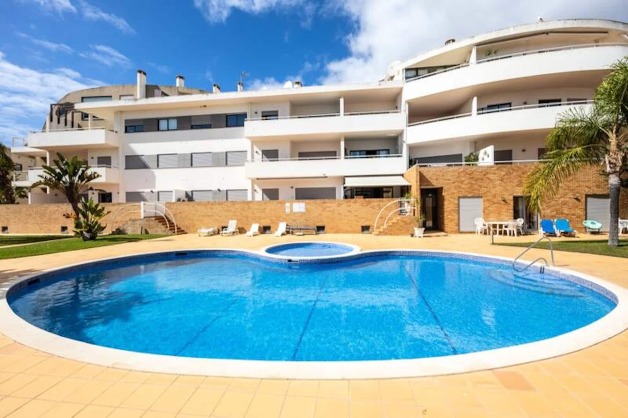 A stone’s throw from the golden sands of Dona Ana Beach, this charming studio in Lagos offers the perfect setting for a romantic getaway or a peaceful retreat. Wake up to the gentle sound of waves and the promise of sun-soaked days exploring the Algarve’s stunning coastline. The studio’s prime location places you within walking distance of one of Portugal’s most iconic beaches, known for its dramatic cliffs and crystal-clear waters. Whether you’re seeking relaxation or adventure, this is the ideal base for your holiday. \n\nInside, the studio is thoughtfully designed to ensure comfort and convenience. Two cozy single beds provide restful nights, while the fully equipped kitchen invites you to prepare meals with fresh local ingredients. For those who prefer dining out, a variety of restaurants and cafes are just minutes away, offering everything from traditional Portuguese cuisine to international flavors. The shared swimming pool is a wonderful alternative to the beach, providing a tranquil spot to unwind and soak up the sun. Wi-Fi and TV are included, ensuring you stay connected and entertained throughout your stay. \n\nLagos itself is a treasure trove of history and culture. Wander through the cobblestone streets of the historic center, where you’ll find charming shops, lively bars, and the ancient city walls that tell stories of a bygone era. The harbor area is perfect for a leisurely stroll, watching fishing boats come and go against the backdrop of the shimmering estuary. Beyond the city, the Algarve offers endless opportunities for exploration, from hiking trails and vineyards to water parks and golf courses. \n\nWith Faro Airport just an hour away, this studio is easily accessible yet feels like a world apart. Whether you’re here for the beaches, the culture, or simply to relax, this property promises an unforgettable stay in one of Portugal’s most beloved destinations.