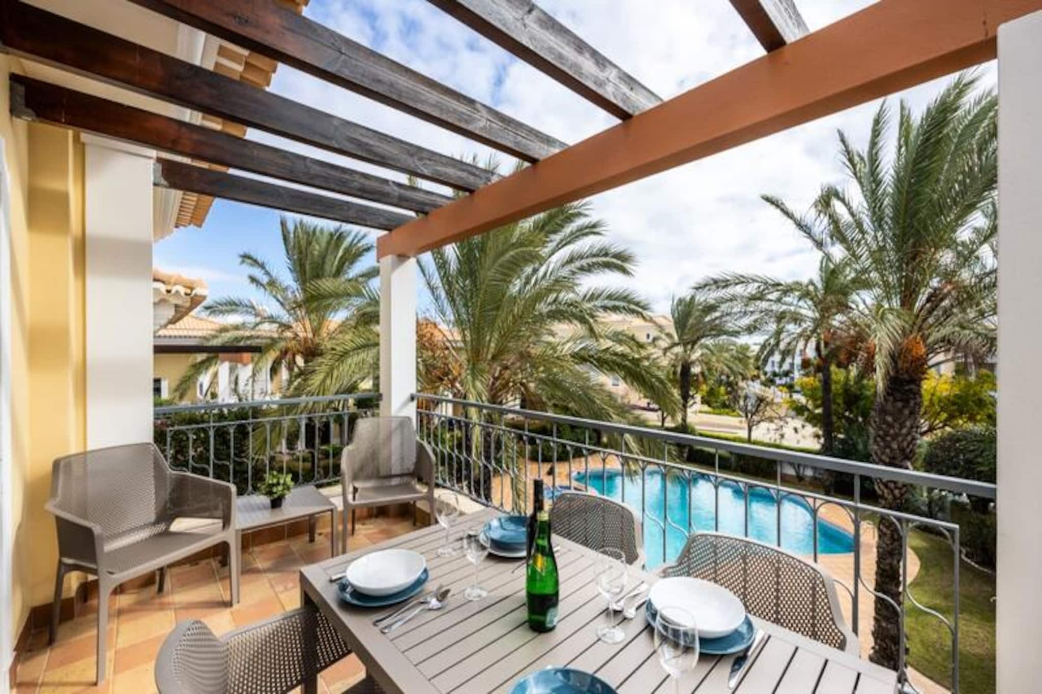 In the serene Porto de Mos neighborhood of Lagos, this bright and modern two-bedroom apartment offers the perfect blend of comfort and convenience for your next seaside escape. Just a short walk from the golden sands of Porto de Mos Beach, this inviting retreat is ideal for families, friends, or couples seeking a relaxing getaway by the Atlantic coast. With its tranquil surroundings and proximity to the vibrant city center, it’s a haven for those looking to enjoy both peace and adventure. 
 
 Step into a spacious and tastefully decorated living area, where elegant furnishings create a welcoming atmosphere. The fully equipped kitchen is perfect for preparing delicious meals, while the private balcony offers a serene view of the communal pool, inviting you to unwind with a morning coffee or an evening glass of wine. The apartment comfortably accommodates up to six guests, featuring a master bedroom with a king-size bed and en-suite bathroom, a twin bedroom with two single beds, and a double sofa bed in the living room for extra guests. Fresh linens, towels, Wi-Fi, and a TV ensure a hassle-free stay. 
 
 Beyond the apartment, a five-minute stroll through a charming park leads you to Porto de Mos Beach, where you can soak up the sun or enjoy a meal at one of the beachfront restaurants. For the more adventurous, the iconic cliffs of Lagos, including Ponte da Piedade, are within walking distance, offering breathtaking views and opportunities for kayaking or paddleboarding. The historic center of Lagos, with its cobbled streets, lively markets, and delicious dining options, is also nearby, providing a perfect balance of seaside tranquility and cultural exploration. 
 
 Whether you’re here to relax by the pool, explore the dramatic coastline, or immerse yourself in the vibrant local culture, this apartment is your gateway to unforgettable memories in Lagos. Book your stay today and discover the magic of Portugal’s Algarve region.
