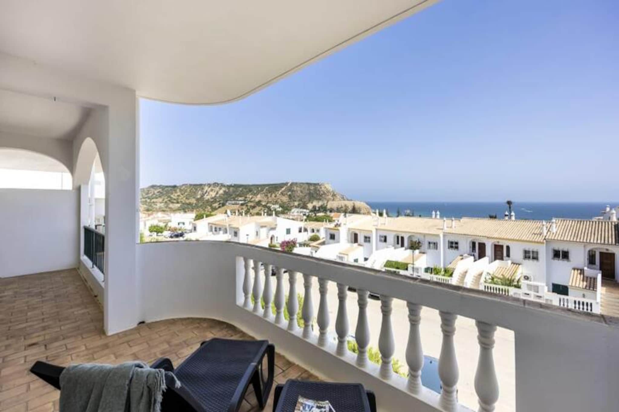 Awaken each morning to the soothing sound of ocean waves and the golden hues of the Portuguese coastline from this bright and stylish 2-bedroom, 2-bathroom apartment. Perfectly positioned in a peaceful neighborhood, this retreat offers a harmonious blend of tranquility and convenience, just a short stroll from the beach, local shops, and charming restaurants. Whether you’re seeking a romantic escape or a family getaway, this apartment provides the ideal setting for unforgettable moments by the sea. 
 
 Step inside to discover a thoughtfully designed space that combines modern elegance with warm, homely touches. The open-plan living area, bathed in natural light, flows seamlessly onto a private balcony where panoramic ocean views take center stage. The fully equipped kitchen invites you to prepare delicious meals, while the two comfortable bedrooms, including one ensuite, ensure restful nights. With Wi-Fi, TV, and private parking, every detail has been considered to make your stay as comfortable as possible.
 
 Beyond the apartment, the delights of the Algarve await. Spend your days lounging on the nearby family-friendly beach, exploring scenic coastal trails, or indulging in water sports like paddleboarding and snorkeling. For a taste of local culture, visit nearby villages or take a short drive to a historic town bustling with markets, a marina, and vibrant nightlife. Guests also enjoy complimentary access to a nearby hotel pool, adding an extra touch of luxury to your stay.
 
 Whether you’re savoring a sunset on the balcony or embarking on an adventure along the cliffs, this apartment offers the perfect base for your Portuguese escape. Book now and let the beauty of the Algarve captivate you.