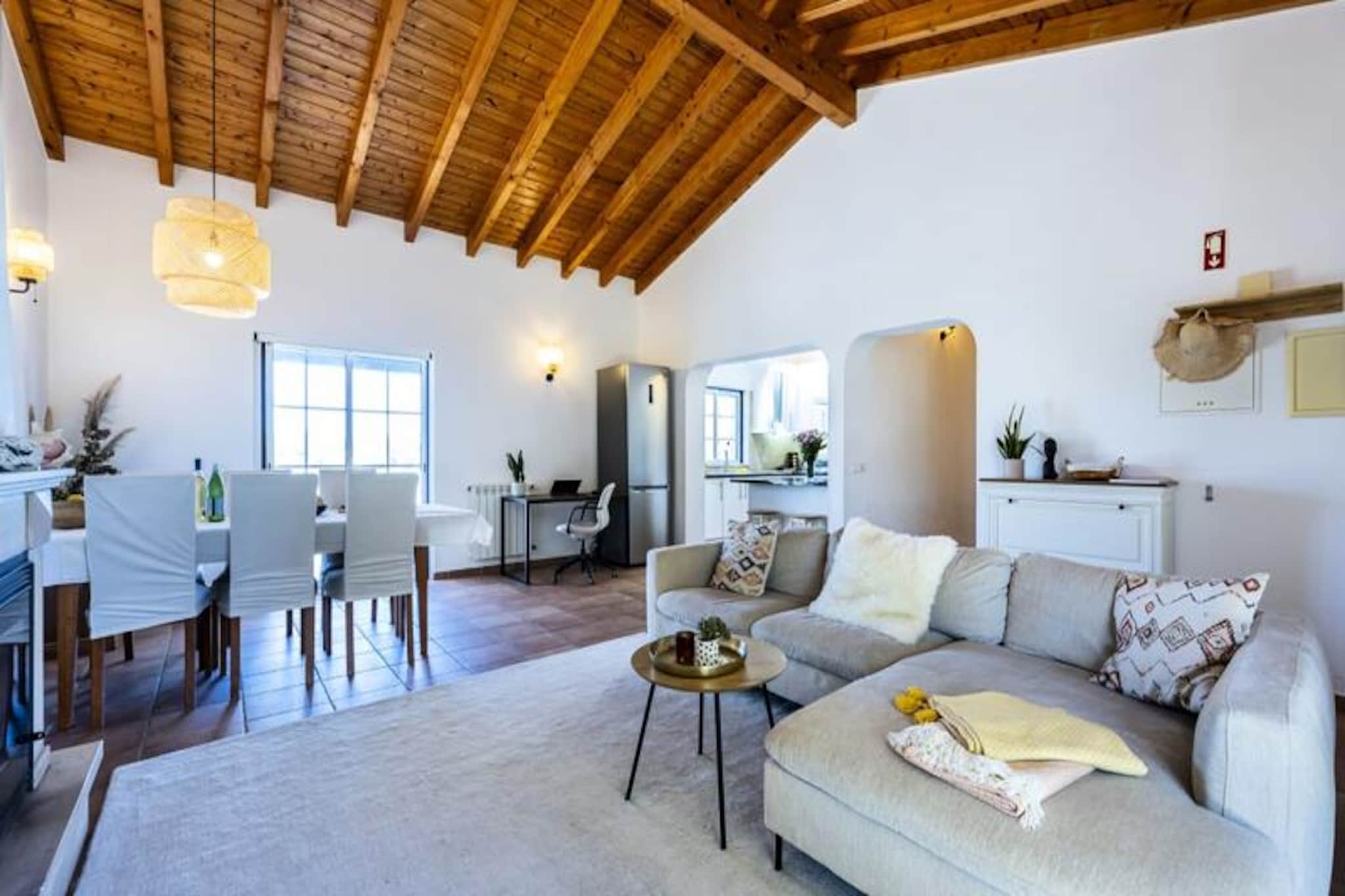 Amid the serene beauty of Vale da Telha, this contemporary Portuguese villa offers a luxurious retreat where modern elegance meets natural tranquility. Surrounded by the breathtaking landscapes of the Aljezur region, this property is a haven for those seeking peace, comfort, and a touch of sophistication. Whether you're sipping your morning coffee on the sunlit front terrace or unwinding with a glass of wine as the sun sets over the back terrace, every moment here feels like a dream.
The villa boasts a spacious main house with three beautifully designed bedrooms and two bathrooms, ensuring ample space for families or groups. The open-plan living area is bathed in natural light, thanks to large windows that frame the picturesque surroundings. A state-of-the-art kitchen invites you to create memorable meals, while the private terraces provide the perfect setting for relaxation. Outside, a private pool, a large dining area, and a barbecue await, offering endless opportunities for outdoor enjoyment. For added convenience, the property includes a separate ground-floor apartment with its own bedroom, bathroom, kitchen, and terrace, ideal for additional guests or family members.
Located just a short drive from the vibrant towns of Lagos and Sagres, and within easy reach of Faro Airport, this villa is perfectly positioned for exploring the Algarve's stunning beaches, charming villages, and cultural treasures. Whether you're hiking along the rugged coastline, sampling local cuisine, or simply soaking up the sun by the pool, this villa promises an unforgettable escape.
With fiber-optic internet, modern amenities, and a dedicated management team to assist you, your stay here will be as seamless as it is indulgent. Discover the magic of Vale da Telha and create memories to last a lifetime.