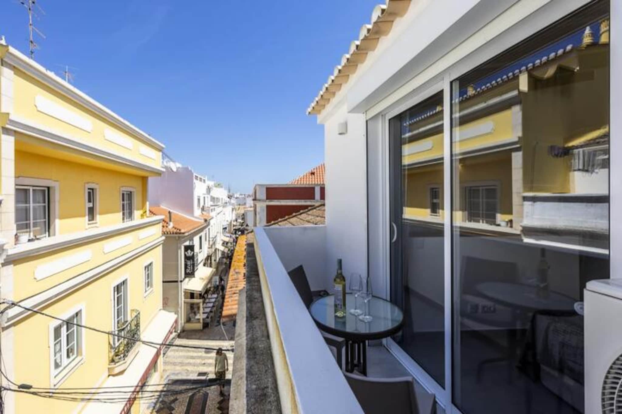 In the heart of Lagos' historic charm, this romantic townhouse offers an intimate escape for couples seeking a blend of tranquility and vibrant local culture. Imagine waking up to the soft sounds of the cobblestone streets below, with golden sunlight streaming through your window, and stepping out onto your private balcony to savor a morning coffee while taking in the picturesque views of the historic architecture and lively street life. This is where timeless romance meets modern comfort. 
 
 Designed with couples in mind, the townhouse features a cozy bedroom with a luxurious queen-size bed adorned with high-quality linens, ensuring restful nights after days filled with exploration. The fully equipped kitchen invites you to prepare meals together, while the modern bathroom adds a touch of elegance to your stay. The balcony, a highlight of the property, is perfect for unwinding with a glass of wine as the sun sets over the vibrant neighborhood. With air conditioning, heating, and free Wi-Fi, every detail has been considered to make your stay as comfortable as possible.
 
 Step outside, and you’re just moments away from Lagos’ stunning beaches, quaint shops, and a variety of exquisite restaurants and lively cafes. The town’s dramatic cliffs and azure waters are best explored by boat, kayak, or stand-up paddleboard, offering unforgettable experiences for adventurers and nature lovers alike. The historic center, with its vibrant atmosphere and rich cultural heritage, is a treasure trove waiting to be discovered.
 
 Whether you’re strolling hand in hand along the marina, indulging in fresh local cuisine, or simply relaxing in the privacy of your townhouse, this property promises a romantic getaway that will linger in your memories long after you leave. Perfectly located and thoughtfully designed, it’s the ideal base for exploring the beauty and charm of Lagos.