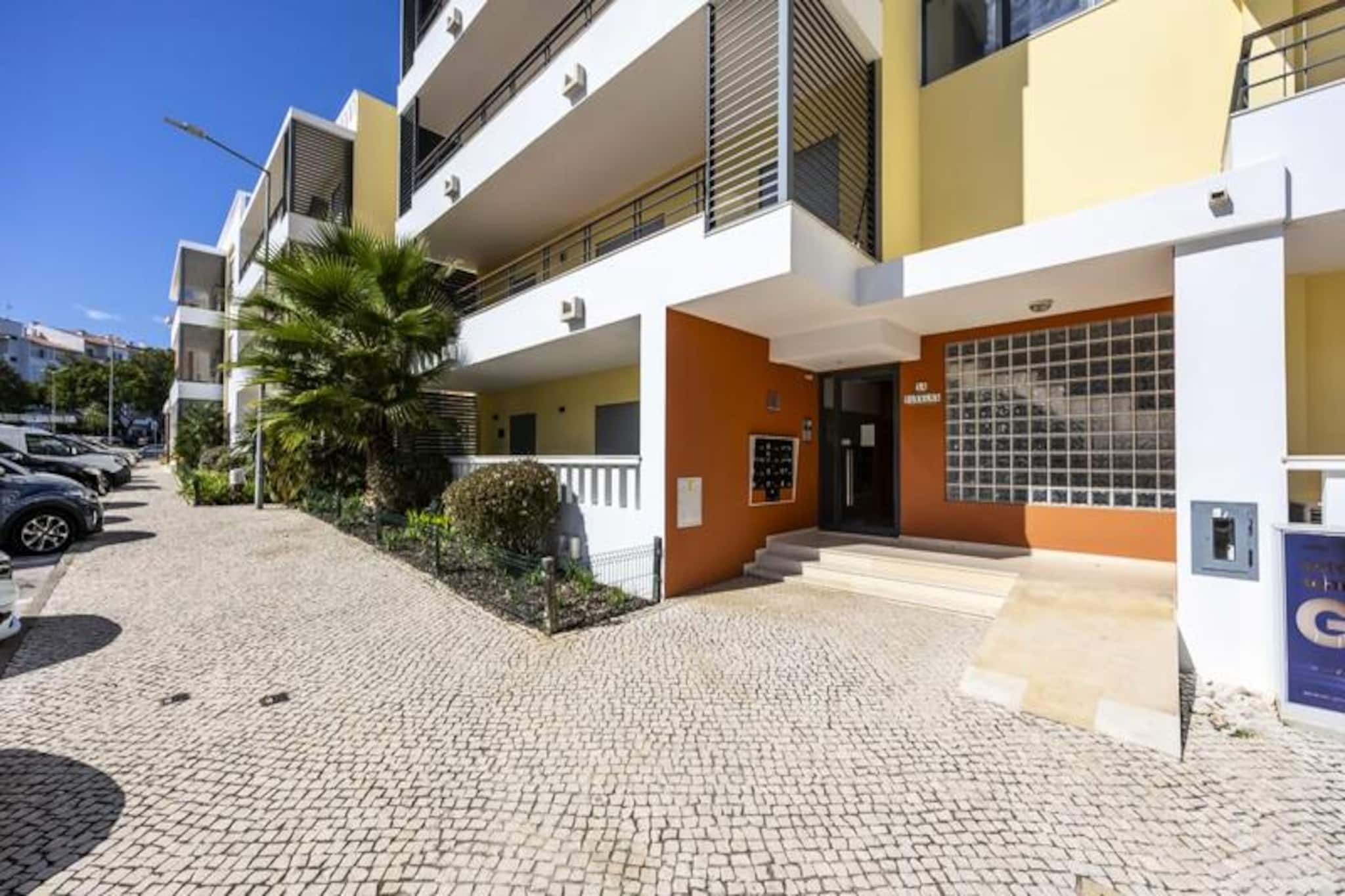 In the heart of Lagos, where golden beaches meet historic charm, this delightful apartment offers a serene escape for families and small groups. Imagine waking up to the gentle sounds of the Algarve, stepping out onto your private balcony with a morning coffee, and planning a day of exploration or relaxation in this vibrant coastal town. With its lush green garden and shared pools, this property is a haven for both adults and children seeking a perfect holiday retreat.
Designed with comfort and convenience in mind, the apartment accommodates up to four adults and two children. It features two spacious bedrooms, a cozy sofa bed, and two modern bathrooms. The fully equipped kitchen invites you to prepare delicious meals, while the airy living space ensures a relaxing atmosphere after a day of adventure. The private balcony is the ideal spot to unwind with an evening drink, soaking in the tranquil surroundings.
Just a short stroll away, the lively center of Lagos awaits. Discover traditional Portuguese cuisine in local restaurants, browse charming shops, or enjoy the bustling marina. For beach lovers, the stunning shores of Dona Ana, Batata, and Meia Praia are within a 10-15 minute walk, offering crystal-clear waters and breathtaking cliffs. Don’t miss a visit to the iconic Ponta da Piedade lighthouse or a boat trip to explore the mesmerizing caves.
Whether you’re here to relax by the pool, explore the historic streets, or embark on coastal adventures, this apartment provides the perfect base for an unforgettable Algarve getaway. Book now and create lasting memories in the enchanting town of Lagos.