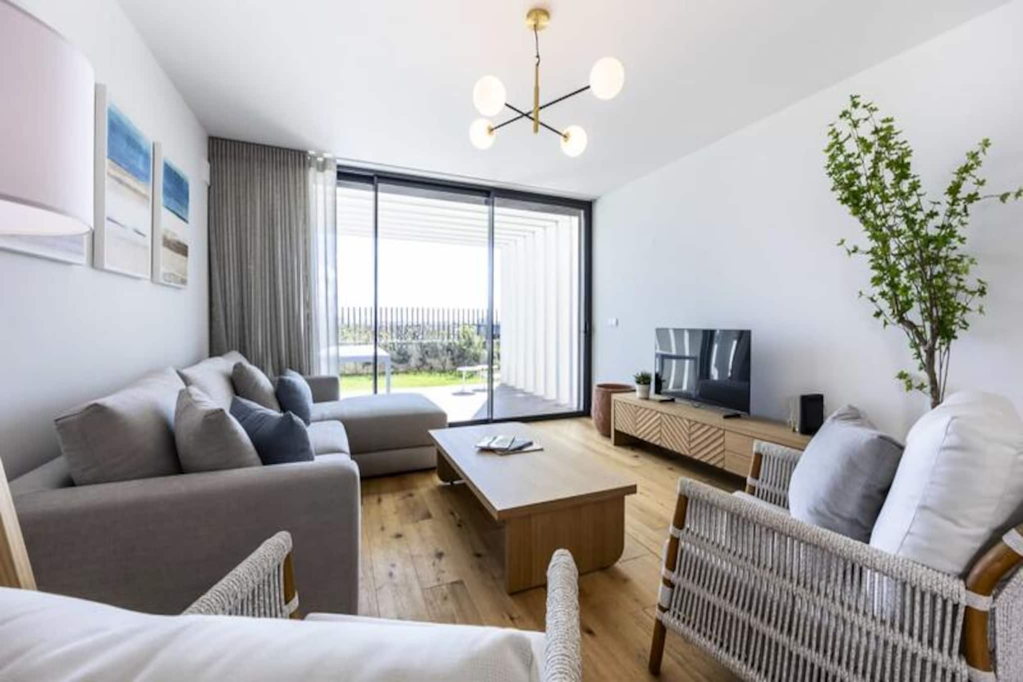 Imagine waking up to the sound of gentle waves and the golden hues of the Algarve sun streaming into your modern beachfront apartment in Fuseta. This serene retreat offers a perfect blend of contemporary design and natural beauty, making it an idyllic escape for those seeking tranquility by the sea. With the Ria Formosa as your backdrop, every moment here feels like a postcard come to life. 
 
 Inside, the apartment boasts two elegant bedrooms, each featuring a plush queen-size bed, and two sleek bathrooms designed for your comfort and privacy. The open-plan living area is bathed in natural light, thanks to expansive windows that frame breathtaking ocean views. A fully equipped kitchen invites you to prepare meals at your leisure, though the allure of Fuseta’s fresh seafood might tempt you to dine out. Step onto your private terrace to savor your morning coffee or unwind with a glass of wine as the sun sets over the horizon. 
 
 Beyond your doorstep, a shared swimming pool overlooking the sea offers a refreshing escape, while the beach is just steps away, inviting you to indulge in leisurely swims or strolls along the shore. Fuseta’s charming fishing village, with its vibrant cafes, local markets, and authentic Algarve atmosphere, is within easy reach. Nature enthusiasts will delight in exploring the Ria Formosa Natural Park, a haven for birdwatching, kayaking, and scenic walks. 
 
 Whether you’re here to relax by the water, savor the region’s culinary delights, or explore the Algarve’s stunning landscapes, this beachfront apartment is your gateway to an unforgettable coastal getaway.