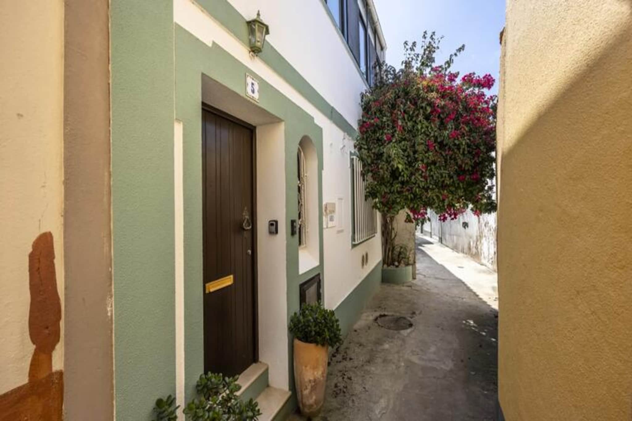 In the heart of Ferragudo’s historic charm, this delightful 2-bedroom townhouse offers an authentic Portuguese experience with breathtaking views of the village and its picturesque harbor. Imagine waking up to the sound of seagulls and the gentle hum of a traditional fishing village, where every corner tells a story of the Algarve’s rich heritage. This is your chance to immerse yourself in the beauty and tranquility of one of Portugal’s most enchanting coastal gems. 
 
 The townhouse is thoughtfully designed to provide both comfort and character. On the ground floor, you’ll find a cozy bedroom with a queen-size bed, while upstairs features a charming double bedroom. A modern bathroom and an additional toilet ensure convenience for all guests. The inviting living area is perfect for unwinding after a day of exploration, and the fully equipped kitchen allows you to prepare meals with fresh local ingredients. Step out onto your private balcony to soak in the stunning views of Ferragudo’s rooftops and the shimmering harbor, a perfect spot for morning coffee or evening wine. 
 
 Ferragudo’s cobbled streets and whitewashed houses lead you to the vibrant Praça Rainha Dona Leonor, where cafes and restaurants offer a mix of local and international flavors. Just across the river, explore the bustling city of Portimão and the golden sands of Praia da Rocha. For golf enthusiasts or those seeking more adventure, the seaside town of Carvoeiro and some of the Algarve’s best courses are just a short drive away. 
 
 Whether you’re here to relax or explore, this townhouse is your gateway to the Algarve’s magic. With its perfect blend of comfort, location, and authentic charm, it promises an unforgettable stay in one of Portugal’s most beloved regions.
