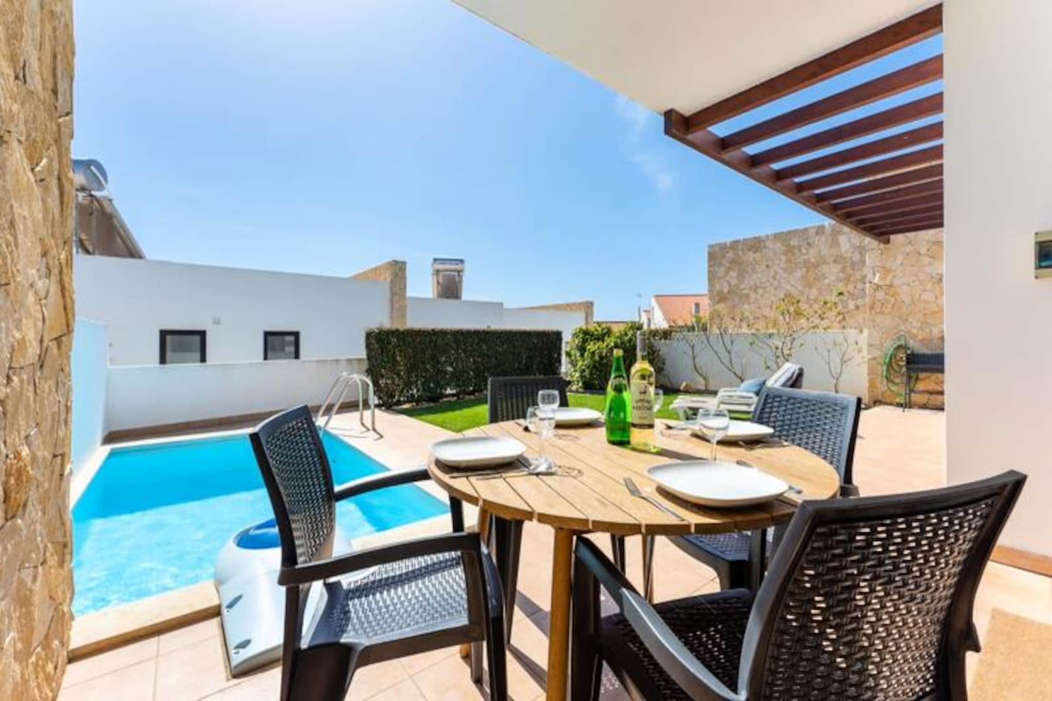 Imagine waking up to the gentle sound of ocean waves and the warm embrace of the Algarve sun. This charming holiday home, located at the entrance of Sagres, offers the perfect blend of tranquility and adventure. With its private garden and inviting swimming pool, it’s a haven for relaxation, while the stunning beaches of Martinhal, Tonel, Mareta, and Beliche are just a short 1000-meter stroll away, promising endless seaside memories. Whether you’re here to surf, sunbathe, or simply unwind, this property places you at the heart of it all. 

Inside, the home is thoughtfully designed to accommodate up to four guests. The living room, with its serene views of the pool and garden, is a cozy retreat featuring satellite TV, Wi-Fi, and a comfortable sofa. The open-plan kitchen is fully equipped with modern appliances, including a ceramic hob, microwave, oven, refrigerator, freezer, and dishwasher, ensuring you have everything needed to prepare delicious meals. A dining table for four invites you to enjoy al fresco meals under the Algarve sky. 

Beyond the property, Sagres offers a wealth of activities for every traveler. From world-class surfing and diving to scenic hiking and cycling trails, the natural beauty of this region is yours to explore. The nearby Intermarché supermarket, local restaurants, and shops ensure convenience, while the vibrant town center is just a kilometer away. For those seeking further adventures, Lagos and the Slide & Splash water park are within easy driving distance. 

Whether you’re a family, a couple, or a group of friends, this holiday home promises an unforgettable escape. Book your stay today and experience the magic of Sagres, where the ocean meets the horizon and every day feels like a new adventure.