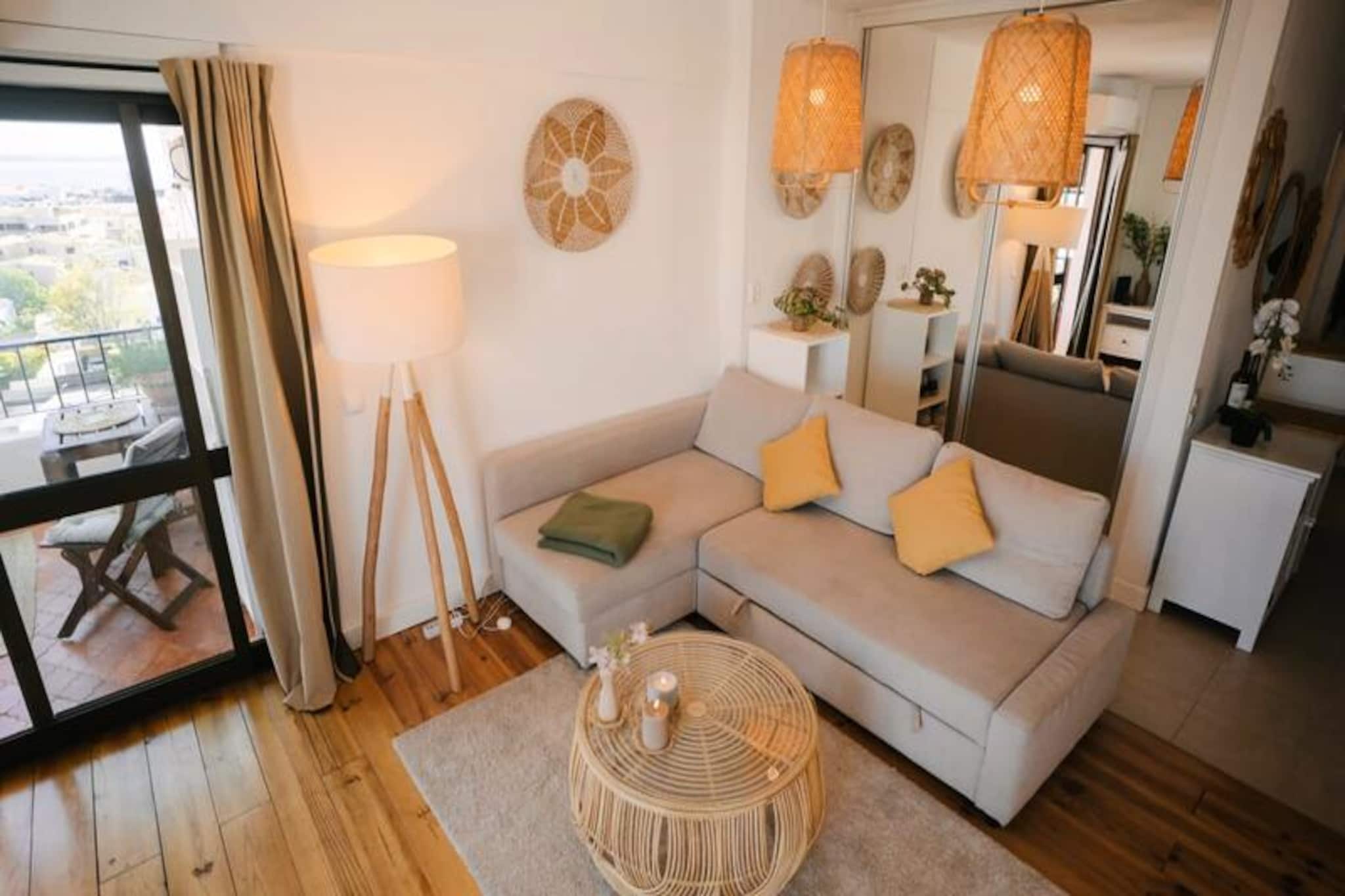 Awaken to sweeping views of Lagos from this inviting 6th-floor studio, a perfect retreat for couples or friends seeking a memorable Algarve escape. From the balcony, marvel at the city’s historic rooftops and the glistening Atlantic Ocean as the sun rises or sets, creating a serene backdrop for your holiday. Whether you’re here to relax or explore, this studio offers a blend of comfort and convenience in the heart of Lagos. \n\nInside, the space is thoughtfully designed to maximize comfort and functionality. The entrance leads to a bright living area with a cozy sofa and a cleverly designed Murphy bed that folds away during the day, creating a spacious environment. A compact yet fully equipped kitchen allows you to prepare meals with ease, while the east-facing balcony invites you to savor breakfast in the morning sun or unwind with a glass of wine in the evening. Modern amenities such as air conditioning, Wi-Fi, and a television ensure a comfortable stay, even during the warm summer months.\n\nStep outside, and you’re just minutes away from Lagos’ golden beaches and vibrant historic center. Explore the cobbled streets lined with shops, restaurants, and cafes, or venture to the marina for water sports like kayaking and paddleboarding. For a refreshing dip, nearby clubs such as Casabah Restaurant and Dona Ana Pools offer pool access for a small fee. The Algarve’s stunning cliffs and coastal trails are also within easy reach, promising unforgettable adventures.\n\nWith its prime location and welcoming ambiance, this studio is the ideal base for discovering the charm and beauty of Lagos. Whether you’re here for the culture, the cuisine, or the coastline, this property ensures a delightful and hassle-free stay in Portugal’s sun-soaked paradise.