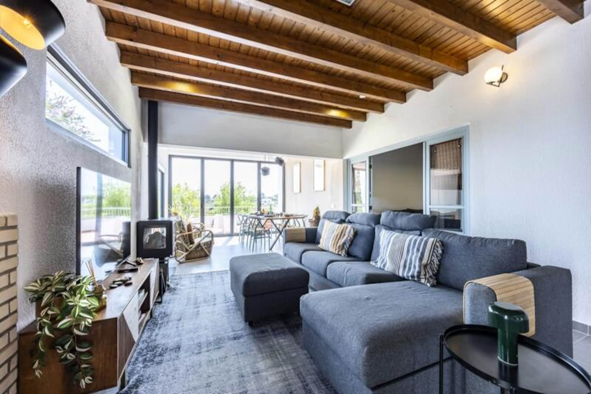 In the heart of the Algarve’s serene Vale da Telha, this charming 2-bedroom villa invites you to unwind and reconnect with nature. Surrounded by the lush beauty of the Costa Vicentina Natural Park, this retreat offers a perfect blend of tranquility and modern comfort, making it an ideal getaway for families, couples, or small groups seeking a peaceful escape. Here, mornings are kissed by golden sunlight, and evenings fade into the soft glow of a southwest-facing horizon.
Step inside to discover a spacious and thoughtfully designed interior. The fully equipped kitchen, complete with a cozy bar area, is perfect for morning coffee or evening chats. The living room, with its expansive glass facade, floods the space with natural light and seamlessly connects to a balcony overlooking a tranquil lake. The villa features two inviting bedrooms: a master with an en-suite bathroom and a second bedroom with twin beds, ensuring restful nights for all. Additional amenities include a second bathroom, a comfortable sofa bed, and modern conveniences like Wi-Fi and television.
Outside, the villa truly shines. The private pool, surrounded by a sun-drenched terrace, invites you to cool off or lounge with a good book. An outdoor bar and barbecue area set the stage for unforgettable evenings under the stars. The villa’s southwest-facing orientation ensures you’ll enjoy sunshine throughout the day, creating a warm and inviting atmosphere.
Just a short stroll away, you’ll find local restaurants serving delicious regional cuisine, small supermarkets for daily essentials, and serene lakes perfect for birdwatching or picnics. The nearby beaches of Arrifana and Monte Clérigo are renowned for their pristine sands and excellent surfing conditions. For a touch of culture, the historic town of Aljezur is a short drive away, offering a Moorish castle, cobbled streets, and a vibrant market filled with local produce and crafts.
Whether you’re seeking relaxation, adventure, or a bit of both, this villa in Vale da Telha offers a slice of Algarve paradise, promising memories to last a lifetime.