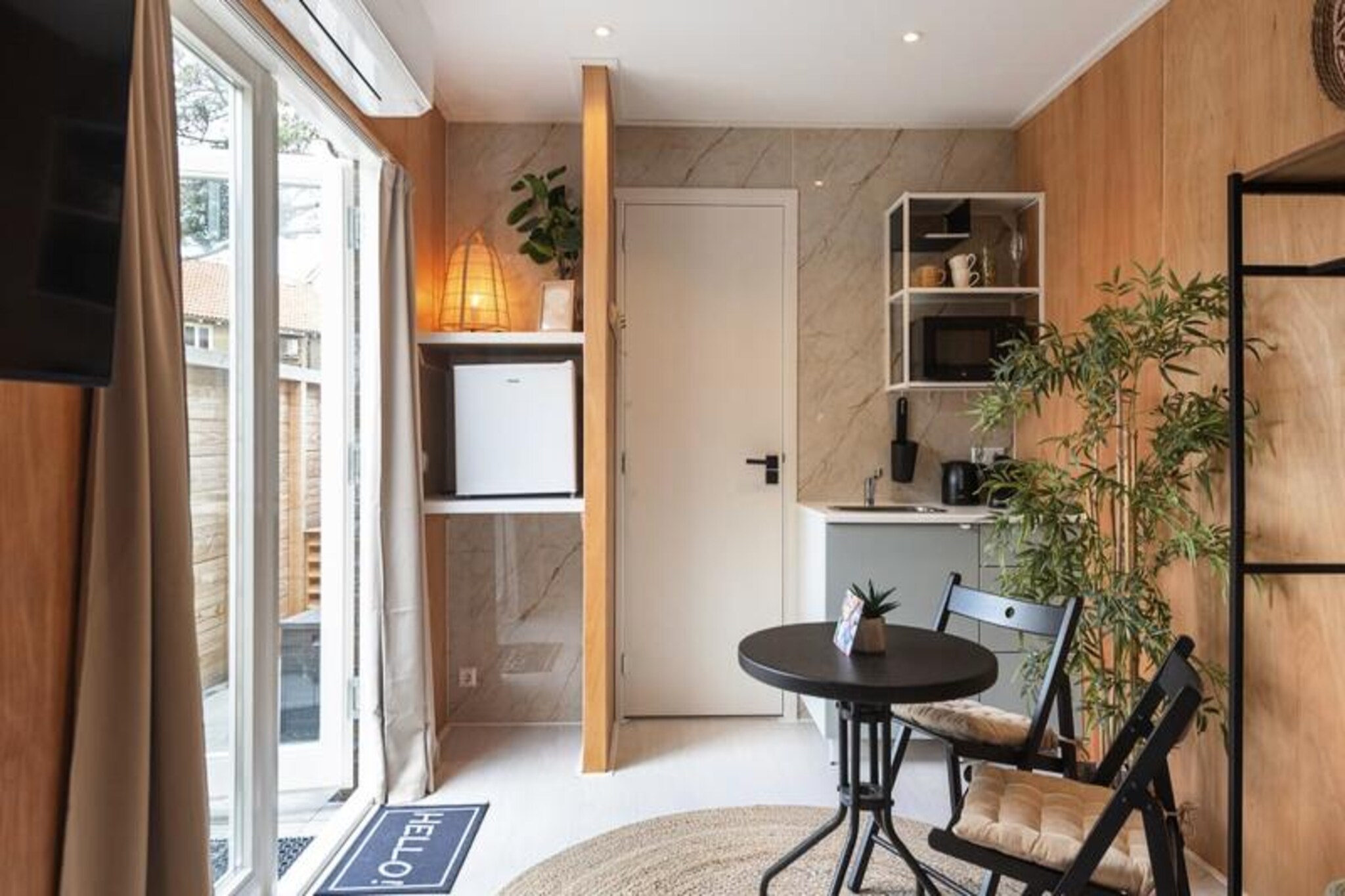 Step into a serene seaside retreat in the charming coastal town of Zandvoort. This modern, soundproofed studio is a haven of tranquility, blending warm wooden accents with soothing natural tones to create a cozy and inviting atmosphere. Just a short stroll from the North Sea's sandy shores, it’s the perfect escape for couples or solo travelers seeking relaxation and rejuvenation. \n\nThe studio is thoughtfully designed for comfort and convenience. A plush 160x200 box-spring bed ensures restful nights, while the kitchenette allows for light meal preparation. The private bathroom features a walk-in shower and modern amenities. The highlight of this retreat is the southwest-facing private terrace, where you can bask in the afternoon sun or enjoy a peaceful morning coffee surrounded by the gentle coastal breeze. With Wi-Fi, TV, and all essentials like bed linen and towels provided, your stay promises to be as comfortable as it is memorable. \n\nZandvoort offers a wealth of activities and attractions to suit every interest. Explore the nearby national parks, De Waterleidingduinen and Kennemerduinen, perfect for walking or cycling amidst stunning natural landscapes. For the adventurous, try surfing, kitesurfing, or even mountain biking around the renowned Circuit Park Zandvoort. The town also boasts vibrant beach clubs, restaurants, and a unique nudist beach for those seeking something different. \n\nConveniently located, the studio is just a short walk from Zandvoort’s train station, connecting you to Amsterdam in under 30 minutes. Whether you’re looking to unwind by the sea or explore the cultural treasures of the Netherlands, this stylish studio offers the ideal base for an unforgettable getaway.