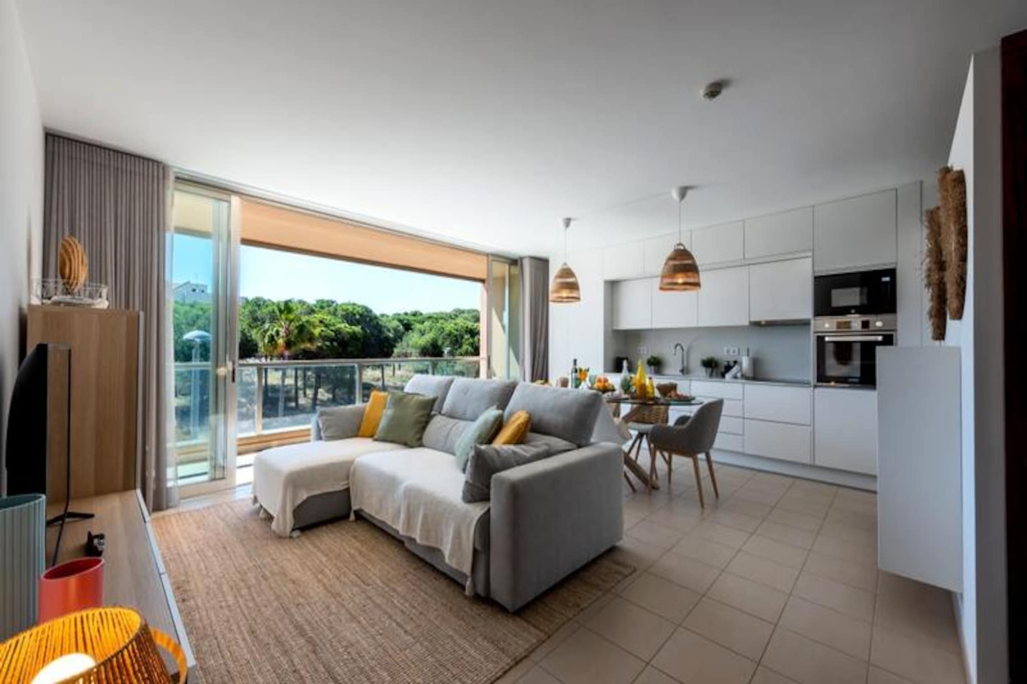 Awaken your senses in the heart of Guia, a charming village in the Algarve where tradition meets coastal allure. This delightful 2-bedroom apartment offers a serene retreat just moments from Albufeira’s golden beaches and the sparkling Atlantic Ocean. Whether you’re here to explore the region’s rich culture or simply unwind by the water, this property promises a memorable stay. 
 
 Step inside to discover a bright and airy living space, thoughtfully designed for comfort and relaxation. The master bedroom features a plush king-size bed and a private en-suite bathroom, while the second bedroom offers two cozy single beds. The living room provides additional sleeping arrangements with two single pull-out beds, making the apartment ideal for families or groups of up to six. Large sliding doors open onto a private east-facing balcony, perfect for enjoying your morning coffee or a quiet evening under the stars. The fully equipped kitchen and dining area invite you to prepare and savor delicious meals together. 
 
 Guests have access to a refreshing communal swimming pool, a highlight of the residence that adds a touch of luxury to your stay. Beyond the apartment, Guia offers a wealth of attractions. Known as the birthplace of the famous piri-piri chicken, the village is a haven for food lovers, with numerous restaurants serving authentic Portuguese cuisine. Nature enthusiasts will appreciate the scenic trails and vineyards surrounding the area, while families can enjoy a day at the nearby Zoomarine Water Park. For shopping and entertainment, the Algarve Shopping Mall is just a short drive away. 
 
 With its blend of comfort, convenience, and proximity to both natural beauty and cultural landmarks, this apartment is the perfect base for your Algarve adventure. Whether you’re exploring the vibrant town of Albufeira, relaxing on pristine beaches, or discovering the hidden gems of southern Portugal, Guia offers a tranquil yet connected setting for an unforgettable holiday.