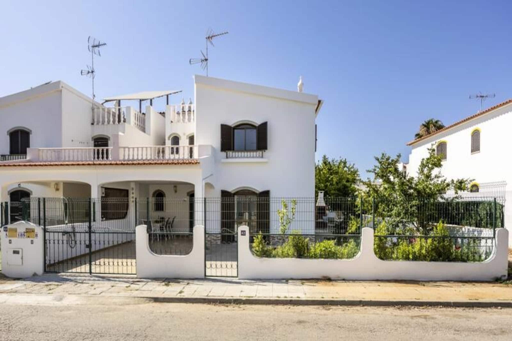 In the serene coastal town of Altura, this spacious 4-bedroom townhouse invites you to unwind under the Algarve sun. Just a short 10-15 minute stroll from the golden sands of the beach, this home is a haven for families or groups of friends seeking a mix of relaxation and adventure. With its southeast-facing orientation, the property is bathed in sunlight throughout the day, creating a warm and welcoming atmosphere. 
 
 Step inside to discover a thoughtfully designed space. The ground floor features a bright and airy living room with comfortable seating and a dining area, perfect for gathering after a day of exploration. The fully equipped kitchen makes meal preparation a breeze, while the ground-floor bedroom with an en-suite bathroom and office area offers both comfort and practicality. Upstairs, three beautifully furnished bedrooms and two additional bathrooms provide ample space for everyone. Private balconies on the upper floor are ideal for sipping morning coffee or soaking up the afternoon sun. Ceiling fans in every room ensure a cool and pleasant stay, even during the warmest days. 
 
 Outside, a barbecue area awaits for delightful summer evenings, and secure parking is available for your convenience. The townhouse is perfectly positioned, just a short walk from Altura’s lively town center, where you can explore local shops, restaurants, and cafes. For nature lovers, the nearby Ria Formosa Natural Park offers breathtaking landscapes and opportunities for kayaking or paddleboarding. A short drive will take you to Tavira or even across the border into Spain, making this an excellent base for discovering the Algarve and beyond. 
 
 Whether you’re here to relax on the beach, explore the region’s natural beauty, or simply enjoy quality time with loved ones, this charming townhouse in Altura promises an unforgettable holiday experience.