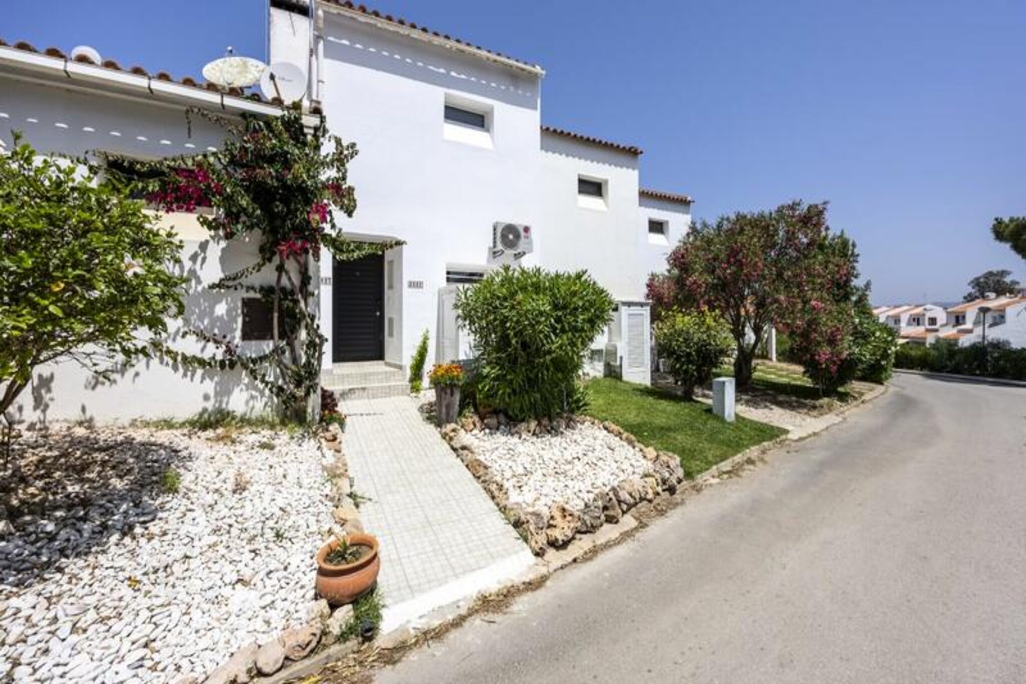 Immerse yourself in the serene beauty of Portugal’s Algarve region with this modern and spacious 1-bedroom apartment, perfectly situated in the peaceful Alfamar area near Olhos de Água, Albufeira. Just a short stroll from the iconic Falésia Beach, this property offers the ideal blend of tranquility and accessibility, making it a haven for couples or small families seeking a memorable getaway. Picture yourself waking up to the gentle sea breeze, enjoying your morning coffee on the private west-facing patio, and taking leisurely walks along the golden sands of one of the Algarve’s most celebrated beaches. 

Step inside this thoughtfully designed apartment, where comfort meets style. The open-plan living and dining area is bathed in natural light, creating a warm and inviting atmosphere. The fully equipped kitchen is perfect for preparing fresh meals with local ingredients, while the cozy sofa bed provides additional sleeping space for guests. Upstairs, the bedroom features a plush double bed and a charming balcony, offering a perfect spot to unwind with a book or admire the sunset. The modern bathroom, complete with a refreshing shower and washing machine, ensures all the comforts of home. With air conditioning in both the bedroom and living room, your stay is guaranteed to be comfortable year-round.

Beyond the apartment, the Alfamar area offers a peaceful retreat with easy access to vibrant attractions. Falésia Beach, renowned for its dramatic red cliffs and soft sands, is just a 5-minute walk away. Explore the coastline’s natural beauty, enjoy a drink at one of the beachfront bars, or venture further to the lively Vilamoura Resort. For family fun, the nearby Zoomarine park and water parks in Quarteira and Lagoa promise unforgettable experiences. Albufeira’s bustling town center, with its array of restaurants, shops, and nightlife, is just a 15-minute drive away.

Whether you’re seeking relaxation or adventure, this apartment is your gateway to the best of the Algarve. With free on-site parking and excellent transport links, you’ll have everything you need for a stress-free holiday. Let the charm of Alfamar and the allure of Falésia Beach create memories you’ll cherish forever.