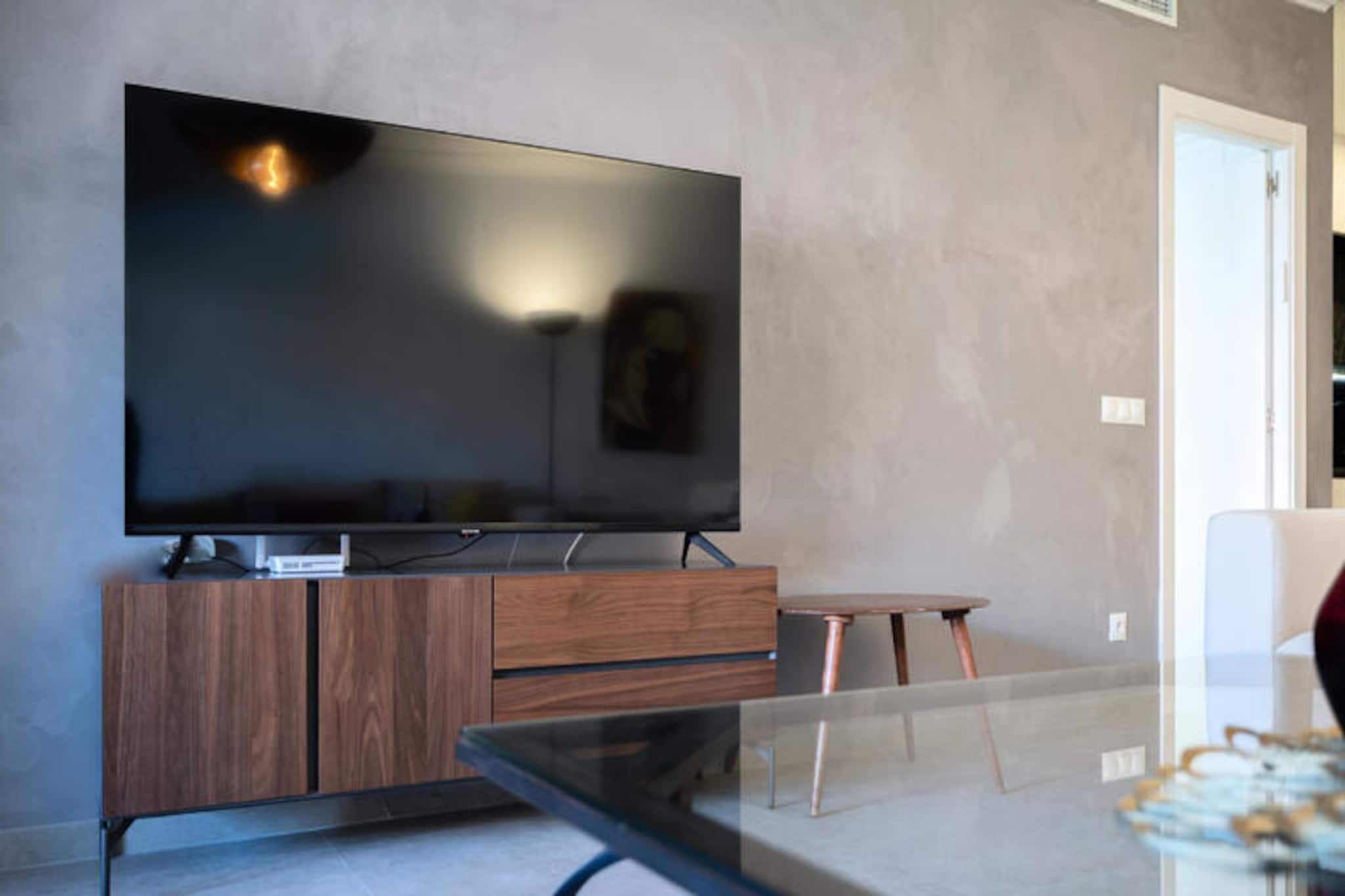 Step into a world of elegance and relaxation in this modern, recently renovated apartment located within the prestigious El Embrujo Playa residence near Puerto Banús. Perfectly suited for families, couples, or small groups, this ground-floor retreat combines contemporary style with an unbeatable location just 700 meters from the golden sands of the Mediterranean. Whether you're seeking a tranquil escape or vibrant nightlife, this property offers the best of both worlds. \n\nThe apartment boasts three spacious bedrooms and three bathrooms, ensuring comfort and privacy for all guests. The master bedroom features a Smart TV, while all bedrooms provide ample storage space with built-in closets or wardrobes. The open-plan kitchen, complete with a stylish central island and modern appliances, invites you to prepare delicious meals at home. The bright and airy living and dining area opens onto a private furnished terrace, offering direct access to lush communal gardens and sparkling swimming pools—ideal for unwinding outdoors or enjoying family time. Central air conditioning and private high-speed Wi-Fi ensure a seamless and comfortable stay. \n\nEl Embrujo Playa is a gated community known for its serene atmosphere, expansive gardens, and safe walkways, making it perfect for families with children. Beyond the residence, the glamour of Puerto Banús awaits with luxury boutiques, fine dining, and lively beach clubs like Ocean Club and Sala Beach. For a more laid-back experience, stroll to nearby San Pedro Alcántara or savor Andalusian seafood at local chiringuitos. \n\nWhether you're planning a romantic getaway, a family holiday, or an extended stay, this apartment offers a harmonious blend of comfort, style, and prime location. Create unforgettable memories in Marbella, where the Mediterranean breeze and Andalusian charm set the stage for your perfect vacation.