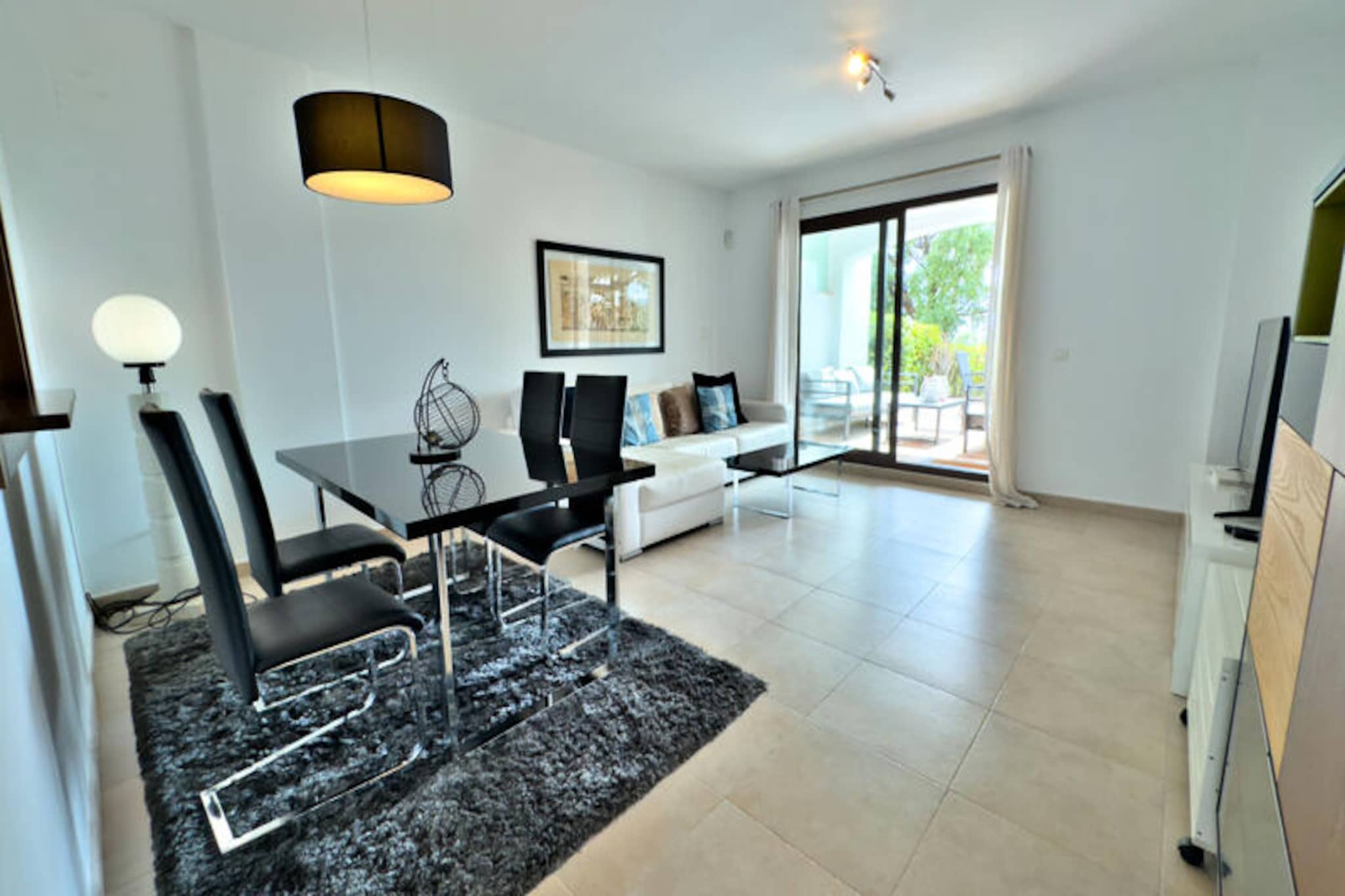 Perched in the serene hills of Marbella, this exquisite ground-floor apartment in the prestigious gated community of Pueblo de Los Monteros offers a luxurious retreat with breathtaking panoramic views of the Mediterranean Sea and the surrounding mountains. Here, tranquility meets elegance, creating the perfect setting for a memorable holiday on the Costa del Sol. Whether you're seeking a peaceful escape or an adventure-filled getaway, this property caters to every desire. \n\nStep inside and discover a haven of comfort and style. The apartment boasts two spacious and sunlit bedrooms, each with built-in wardrobes, ensuring ample storage for your stay. A full bathroom with a shower and an additional guest toilet provide added convenience. The open-plan living and dining area flows seamlessly onto a private terrace, where you can soak in the stunning vistas. The fully equipped kitchen is perfect for preparing meals, while modern amenities like reversible air conditioning, Wi-Fi, and an alarm system enhance your stay. A private parking space is also included for your convenience.\n\nThe highlight of this property is its expansive terrace, a true outdoor haven. With a dining area, a cozy relaxation corner, and a barbecue, it’s the ideal spot to enjoy al fresco meals or unwind with a glass of wine as you watch the sun dip below the horizon. Guests also have access to a communal swimming pool, open during the summer months, and the secure residence ensures peace of mind with surveillance cameras in common areas.\n\nLocated just 15 minutes by car from Marbella's vibrant center and 10 minutes from the area’s most stunning beaches, this apartment is perfectly positioned for exploring the Costa del Sol. Nearby, you’ll find a variety of restaurants, shops, golf courses, and leisure activities, ensuring there’s something for everyone. Whether you’re traveling as a family, a couple, or with friends, this property promises a peaceful and luxurious stay. \n\nBook your stay today and experience the charm of the Mediterranean in this exceptional Marbella retreat. Please note that parties and loud behavior are strictly prohibited to maintain the tranquility of the community.