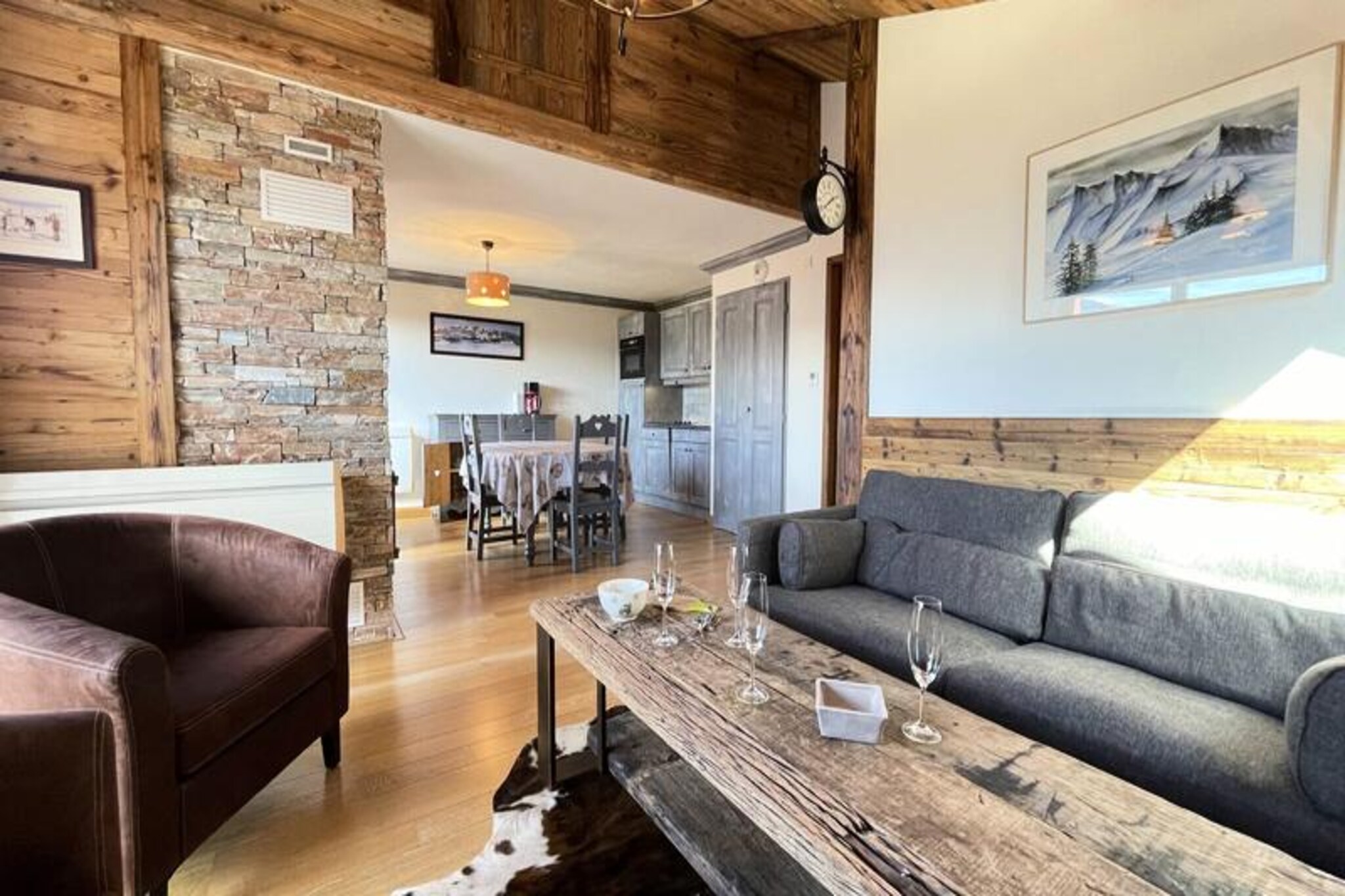 Amid the enchanting alpine charm of Notre Dame de Bellecombe, this delightful Savoyard-style apartment offers a serene retreat just 500 meters from the village center and the renowned Espace Diamant ski slopes. Imagine mornings filled with breathtaking views of Mont Charvin from your west-facing terrace, afternoons exploring 192 kilometers of interconnected slopes, and evenings by the crackling fireplace in your cozy living room. This residence is the perfect blend of comfort and convenience, inviting you to immerse yourself in the beauty of the French Alps. \n\nSpanning 76 square meters, the apartment accommodates up to six guests with three thoughtfully designed bedrooms, including two double rooms and one with twin beds. The open-plan kitchen is fully equipped with modern appliances, making it easy to prepare hearty meals after a day of adventure. A spacious living area with a dining space and lounge ensures ample room for relaxation, while two bathrooms and a separate toilet provide practicality for families or groups. Additional amenities such as WiFi, a washer/dryer, and a private garage enhance the experience, while the working fireplace adds a touch of alpine magic.\n\nBeyond the residence, Notre Dame de Bellecombe beckons with its charming village atmosphere and access to the Espace Diamant ski area, connecting six picturesque resorts. In summer, discover scenic trails, mountain bike paths, and the Mont Rond chairlift, offering panoramic views of Mont Blanc. The nearby Flumet lake and leisure center provide opportunities for swimming and picnicking, while tennis courts and a playground are just 800 meters away. For eco-conscious travelers, an electric vehicle charging station is conveniently located in the village.\n\nWhether you seek thrilling winter sports or tranquil summer hikes, this apartment is your gateway to unforgettable alpine adventures. With its idyllic location, exceptional amenities, and stunning vistas, it’s a haven for creating cherished memories in every season.