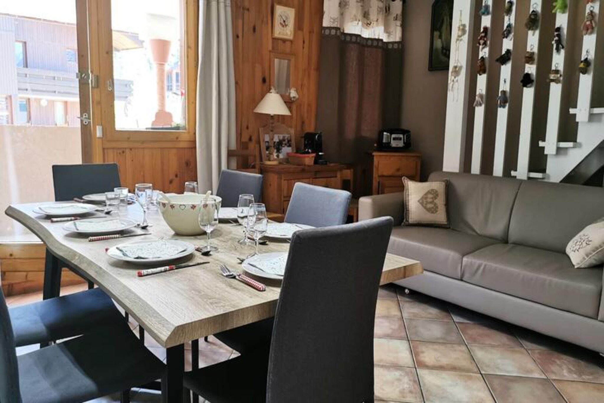 In the picturesque hamlet of Bourg Morel, this charming duplex apartment offers a delightful alpine retreat for up to eight guests. With its warm ambiance and thoughtful layout, it’s the perfect base for families or groups seeking a cozy getaway in the heart of the French Alps. Whether you’re here for winter sports or summer adventures, the property’s location at the foot of the slopes ensures easy access to the region’s natural beauty and activities. Just a short stroll away, the ESF ski school and Piou Piou children’s ski club provide excellent options for learning and fun, while nearby shops cater to all your needs. \n\nInside, the apartment features an open-plan kitchen equipped with modern appliances, including a Nespresso coffee machine, fondue set, raclette grill, and crepe maker—ideal for creating memorable meals. The living room invites relaxation with its comfortable sofa and dining area, while the balcony offers serene views of the surrounding landscape. Sleeping arrangements are thoughtfully designed, with two single beds in the downstairs bedroom, a sofa bed on the mezzanine, and double beds in both upstairs bedrooms. A travel cot is also available for families with young children. \n\nGuests will appreciate the convenience of two bathrooms, one with a combined toilet and shower, and a separate toilet. While linens and cleaning services are available as extras, the apartment’s welcoming atmosphere ensures a pleasant stay. Please note that pets and smoking are not permitted. \n\nFrom skiing and snowboarding in winter to hiking and cycling in summer, Bourg Morel offers a wealth of activities for outdoor enthusiasts. Explore nearby trails, savor local Savoyard cuisine, or simply relax and take in the breathtaking alpine scenery. This apartment combines comfort, practicality, and an unbeatable location for an unforgettable holiday experience.