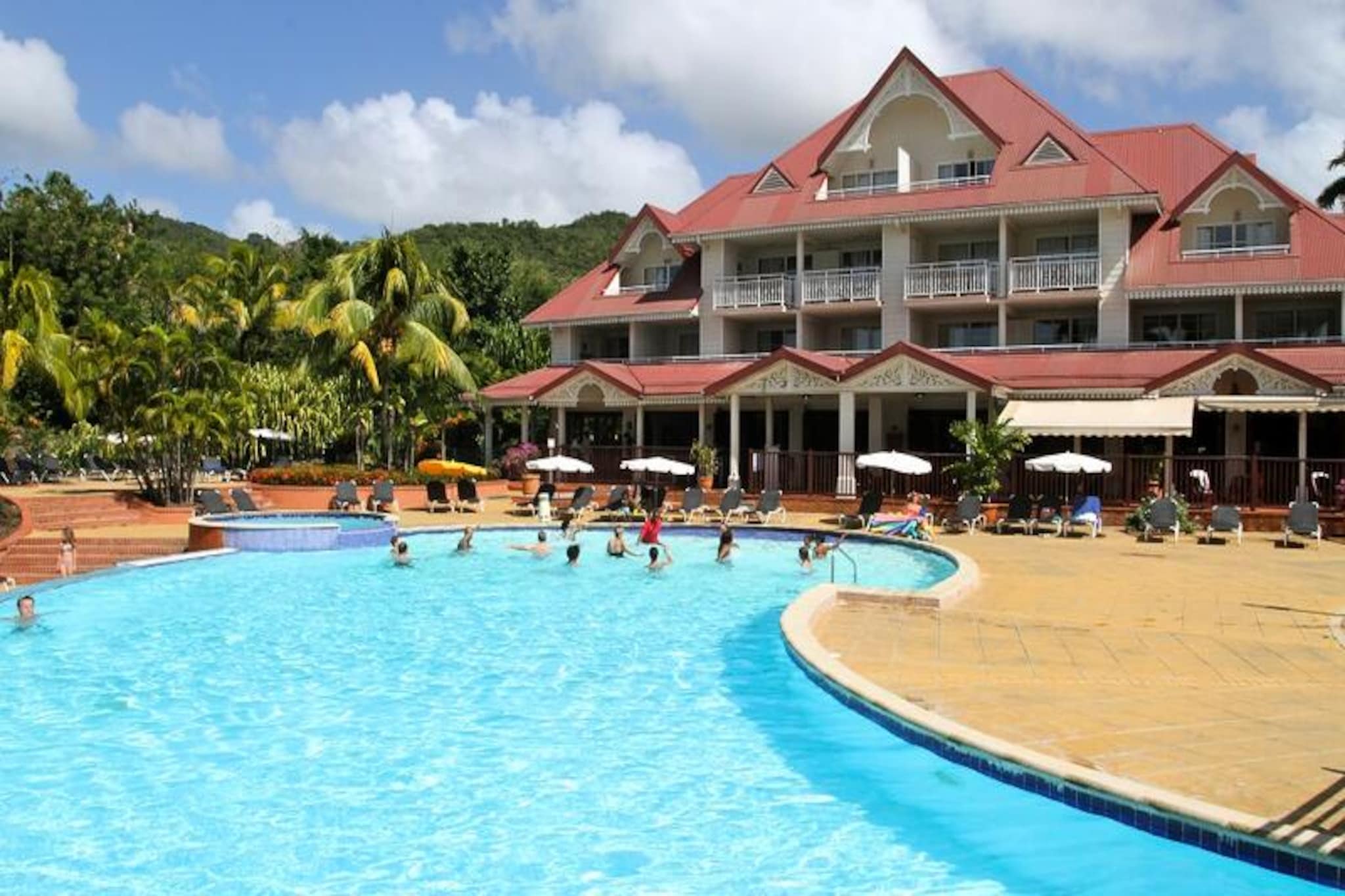 Imagine waking up to the gentle sound of waves and the scent of tropical blooms. Nestled amidst lush greenery, the Sainte Luce Residence - maeva Home in Martinique offers a serene escape where white sand beaches meet the turquoise sea. This tropical haven is perfect for families, friends, or couples seeking a vibrant yet tranquil retreat. With its idyllic beachfront location, you’re just steps away from the soft sands and sparkling waters of the Caribbean.
The residence boasts a bright and airy apartment that comfortably accommodates up to six guests. Featuring two cozy bedrooms, a spacious living room with sofa beds, and a fully equipped kitchen, it’s designed for both relaxation and convenience. The southeast-facing covered terrace offers stunning sea views, making it the perfect spot for morning coffee or evening cocktails. Modern amenities such as air conditioning, Wi-Fi, TV, and a dishwasher ensure a stress-free stay.
For those seeking adventure, the on-site water sports center offers thrilling activities like jet skiing, kayaking, paddleboarding, and even flyboarding. Kids will love the themed clubs catering to ages 3 to 17, while adults can unwind by the expansive 650m² aquatic area featuring a paddling pool and sun deck. The village also boasts several restaurants and a bar, allowing you to savor the rich flavors of Caribbean cuisine without venturing far.
Whether you’re lounging by the pool, exploring the vibrant marine life, or simply soaking in the beauty of Martinique, the Sainte Luce Residence promises an unforgettable tropical getaway. Let the rhythm of the island guide you to a vacation filled with relaxation, adventure, and cherished memories.