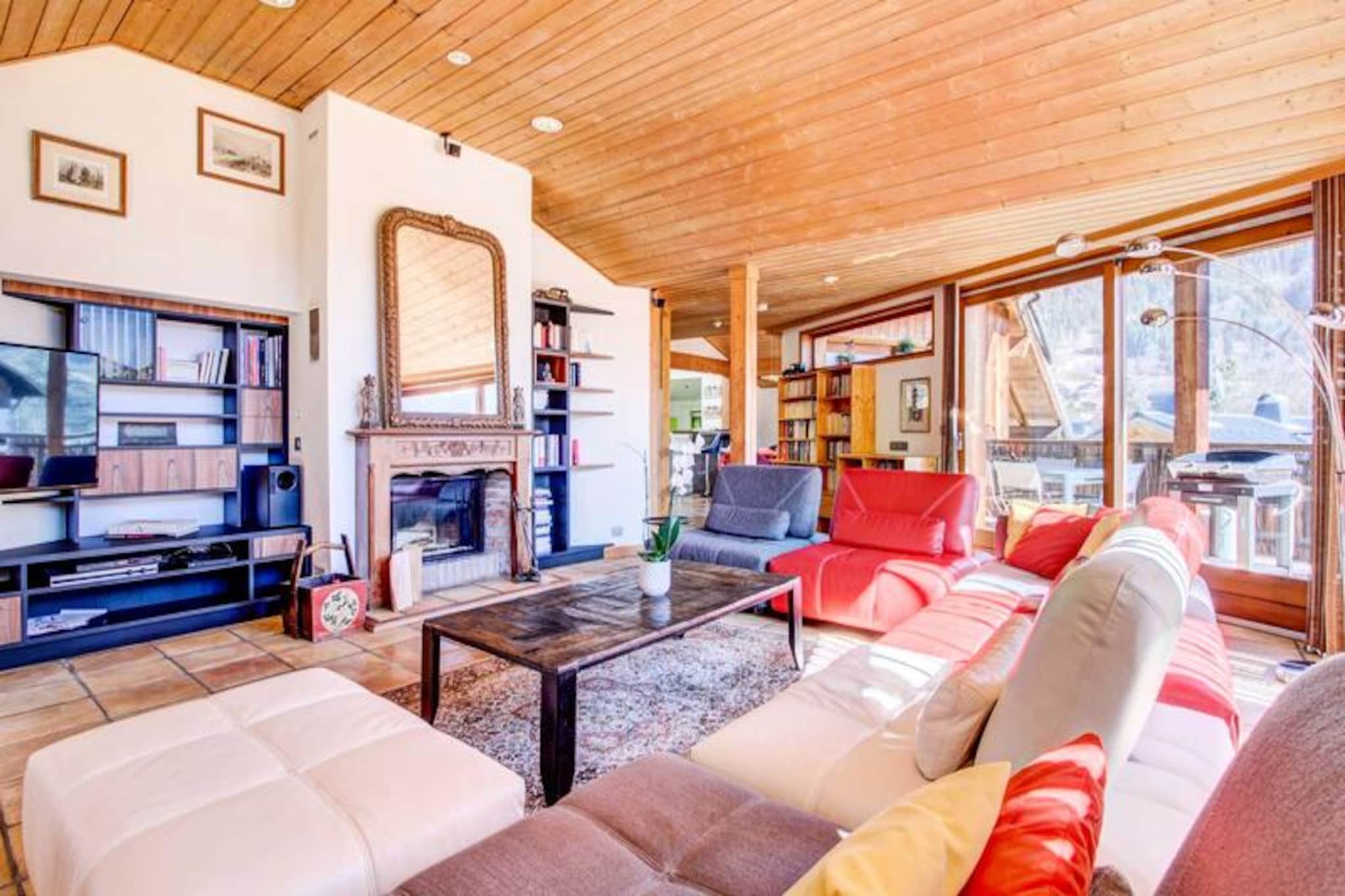 Imagine waking up to the serene beauty of the French Alps, where crisp mountain air and breathtaking views set the tone for your day. This stunning chalet, located just 800 meters from the heart of Morzine and its Tourist Office, offers a peaceful retreat surrounded by nature. With a free shuttle bus stop only 150 meters away, you’re perfectly positioned to explore the charming village and its world-class ski slopes with ease. The chalet’s sunny and tranquil setting ensures a rejuvenating escape for families or groups of up to 12 guests. \n\nSpanning an impressive 280m², this chalet combines rustic alpine charm with modern comforts. It features six beautifully appointed bedrooms, including two double rooms with en suite bathrooms, three twin rooms, and one additional double room. The spacious living room, complete with a cozy fireplace and panoramic mountain views, invites you to unwind after a day of adventure. A fully equipped kitchen and a separate dining room make shared meals a delight, while the sauna and two terraces provide the perfect spaces to relax and soak in the alpine atmosphere. Additional amenities include a laundry room, enclosed garage, Wi-Fi, and even a piano for musical evenings. \n\nSet on a 1500m² garden with private parking, the chalet offers plenty of space to enjoy the outdoors. Morzine’s lively center, with its shops, restaurants, and après-ski options, is just a short stroll or shuttle ride away. In winter, the area transforms into a snowy paradise with endless skiing opportunities, while summer brings hiking, biking, and the chance to explore the stunning landscapes of the Portes du Soleil region. \n\nWith bed linen, towels, and end-of-stay cleaning included, this chalet ensures a hassle-free holiday. Whether you’re here for the slopes, the trails, or simply to relax in a picturesque alpine setting, this property promises an unforgettable stay in the heart of the French Alps.
